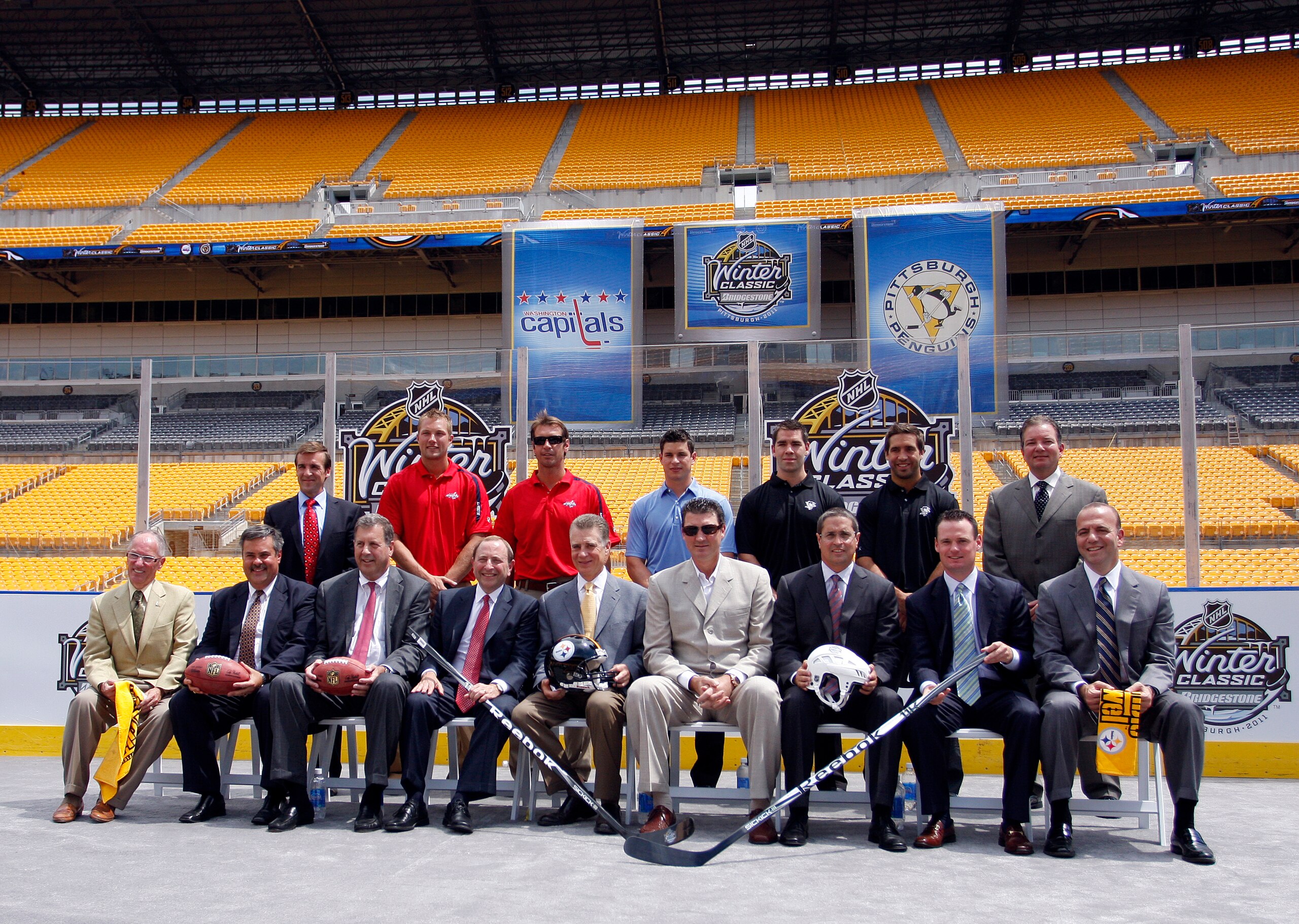 PITTSBURGH - JULY 27:  NHL Commissioner Gary Bettman, Steelers co-Owner and President Art Rooney II, and Penguins Chairman Mario Lemieux pose alongside other NHL personal and local County Officials for a group photo at the 2011 Bridgestone NHL Winter Clas