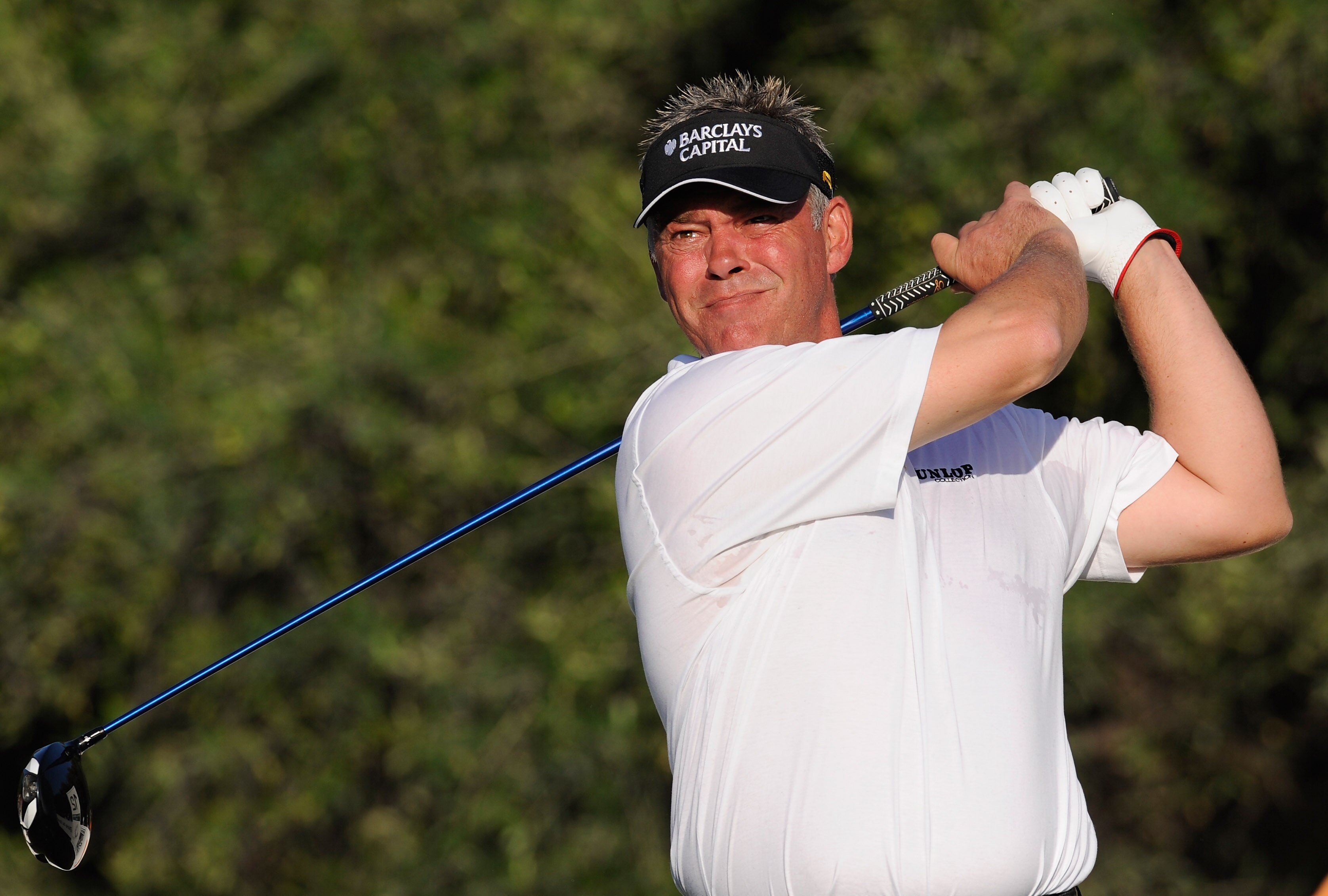 FARO, PORTUGAL - OCTOBER 14:  Darren Clarke of Northern Ireland plays his tee shot on the 12th hole during the first round of the Portugal Masters at the Oceanico Victoria Golf Course on October 14, 2010 in Faro, Portugal.  (Photo by Stuart Franklin/Getty