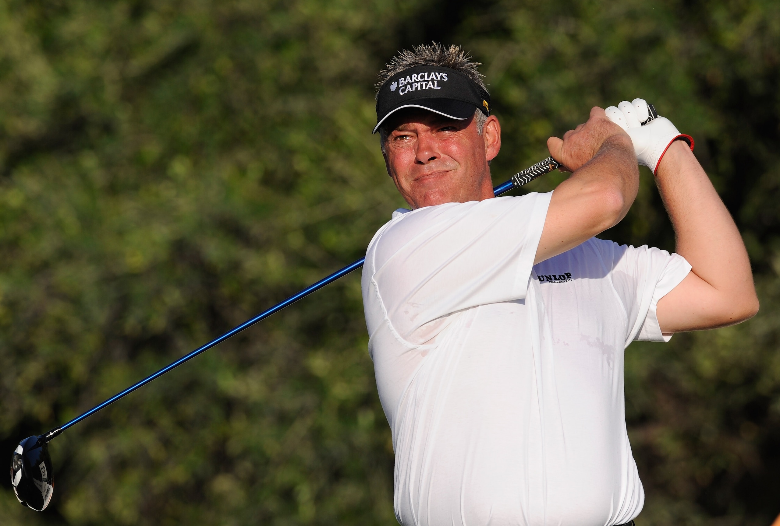 FARO, PORTUGAL - OCTOBER 14:  Darren Clarke of Northern Ireland plays his tee shot on the 12th hole during the first round of the Portugal Masters at the Oceanico Victoria Golf Course on October 14, 2010 in Faro, Portugal.  (Photo by Stuart Franklin/Getty