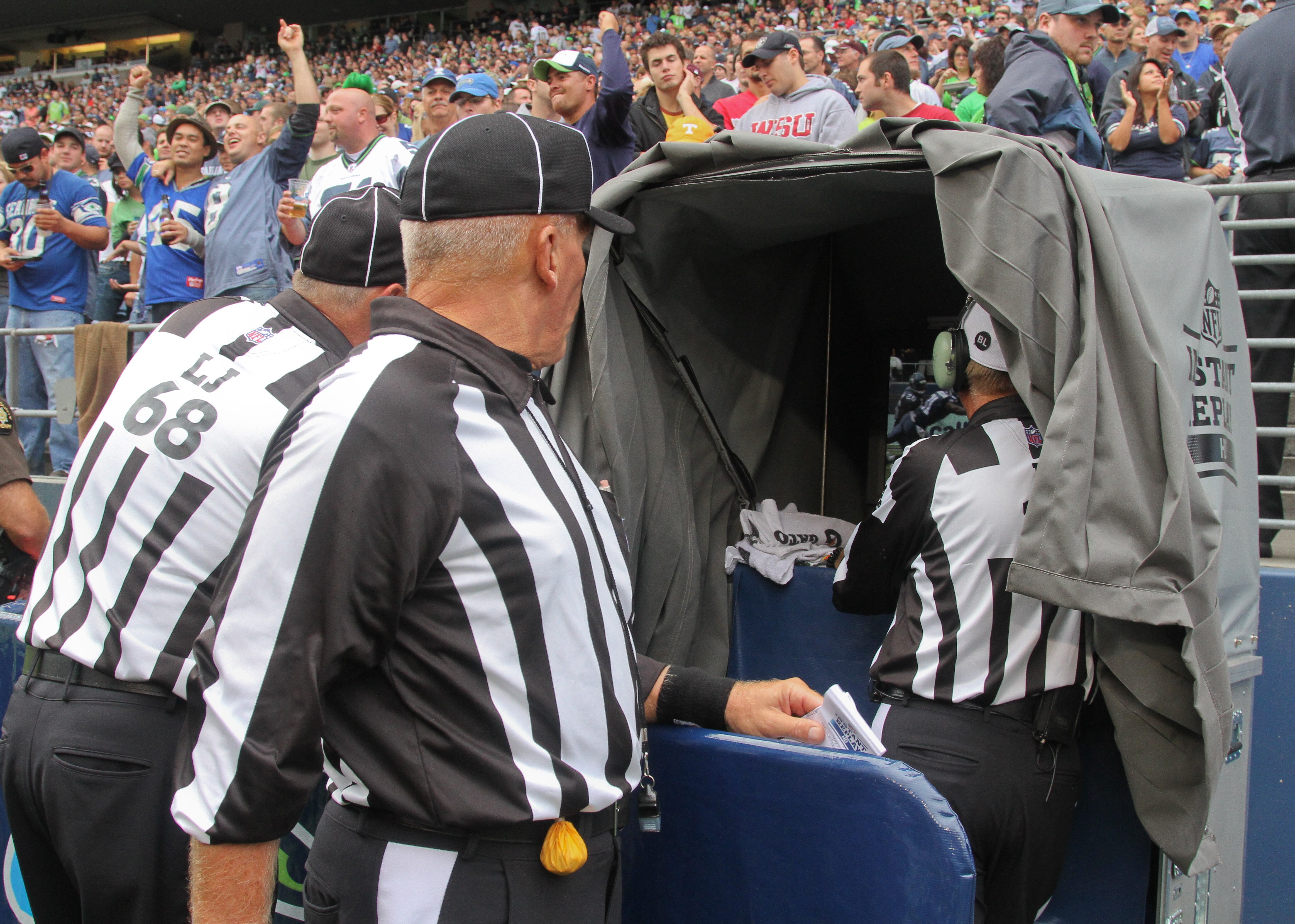 SEATTLE - SEPTEMBER 26:  Referees review a play during the game between the Seattle Seahawks and the San Diego Chargers at Qwest Field on September 26, 2010 in Seattle, Washington. (Photo by Otto Greule Jr/Getty Images)