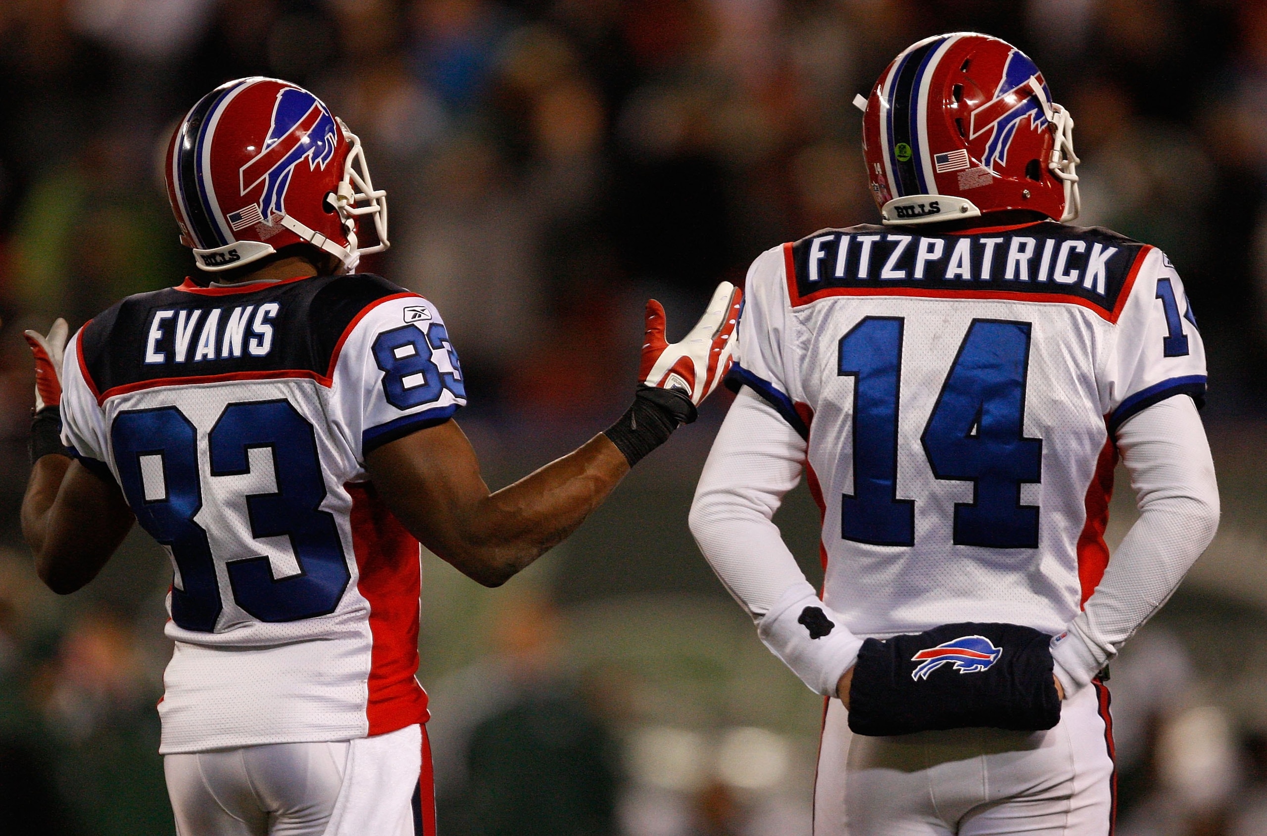 EAST RUTHERFORD, NJ - OCTOBER 18: Lee Evans #83 stands next to Ryan Fitzpatrick #14 of the Buffalo Bills in disbelief after a ruled catch of his was overturned during the game against the New York Jets on October 18, 2009 at Giants Stadium in East Rutherf