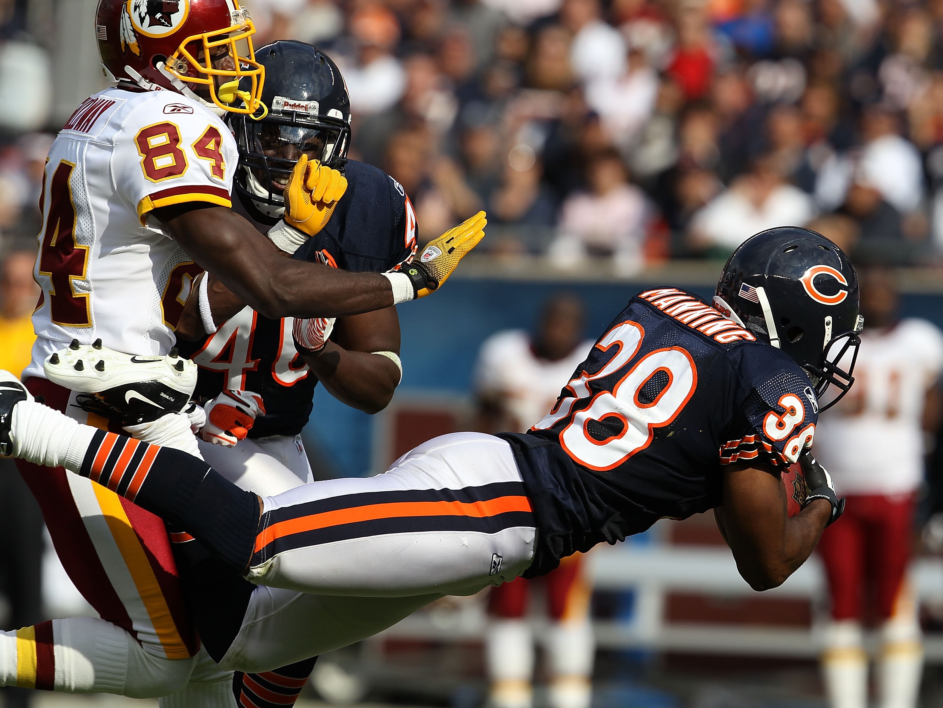 CHICAGO - OCTOBER 24: Danieal Manning #38 of the Chicago Bears intercepts a pass intended for Joey Galloway #84 of the Washington Redskins at Soldier Field on October 24, 2010 in Chicago, Illinois. The Redskins defeated the Bears 17-14. (Photo by Jonathan