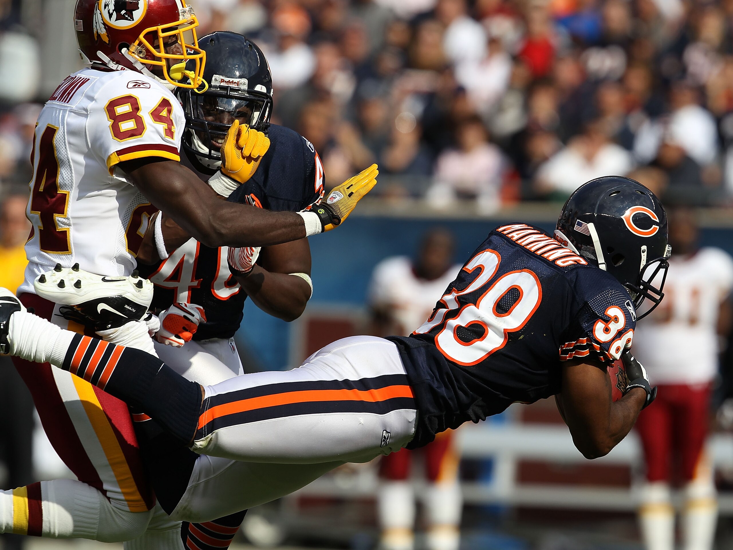 CHICAGO - OCTOBER 24: Danieal Manning #38 of the Chicago Bears intercepts a pass intended for Joey Galloway #84 of the Washington Redskins at Soldier Field on October 24, 2010 in Chicago, Illinois. The Redskins defeated the Bears 17-14. (Photo by Jonathan