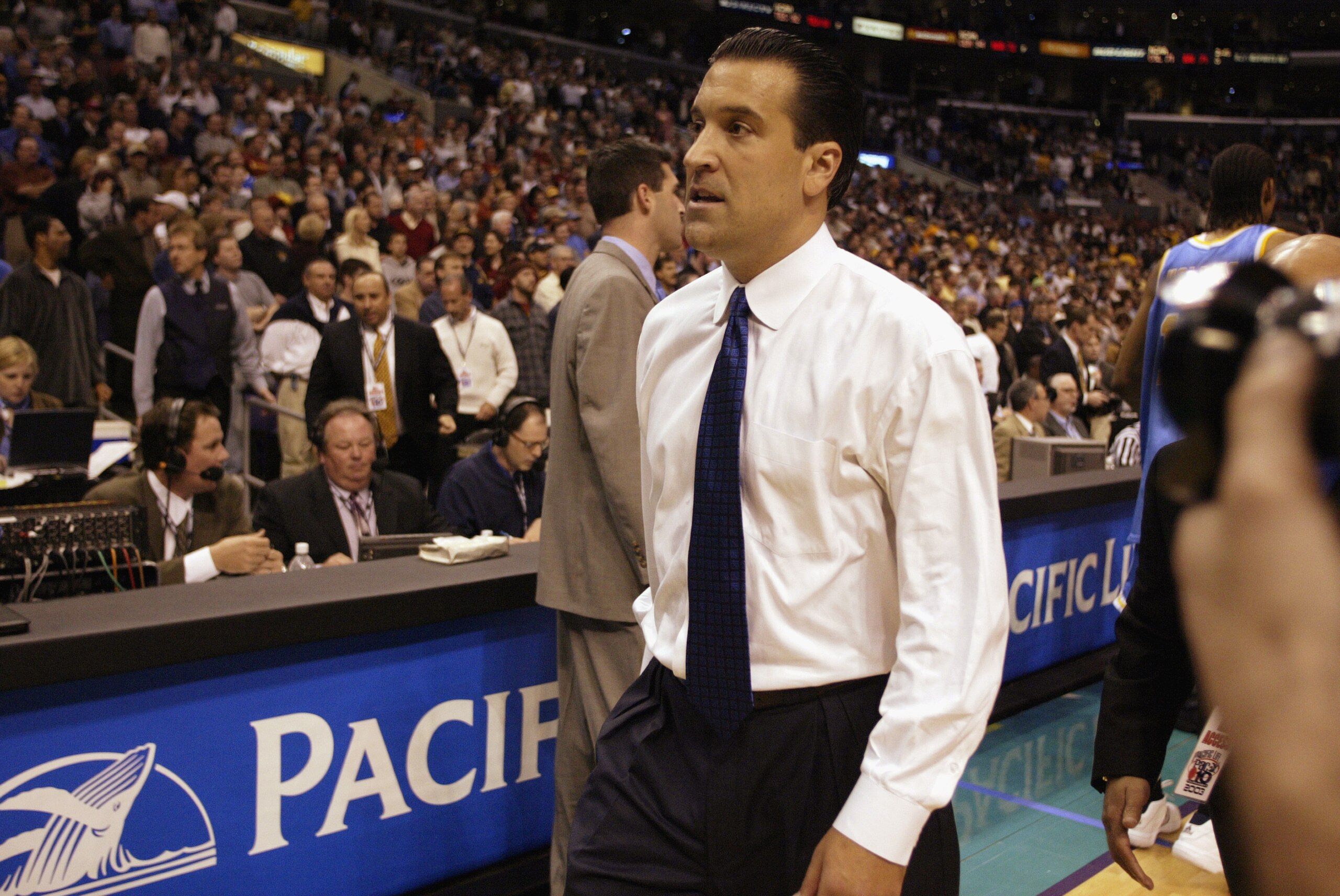 LOS ANGELES - MARCH 14:  UCLA head coach Steve Lavin walks off the floor after being defeated by Oregon in the NCAA Pac-10 Conference tournament semifinals game at the Staples Center on March 14, 2003 in Los Angeles, California.  In what could be Lavin's