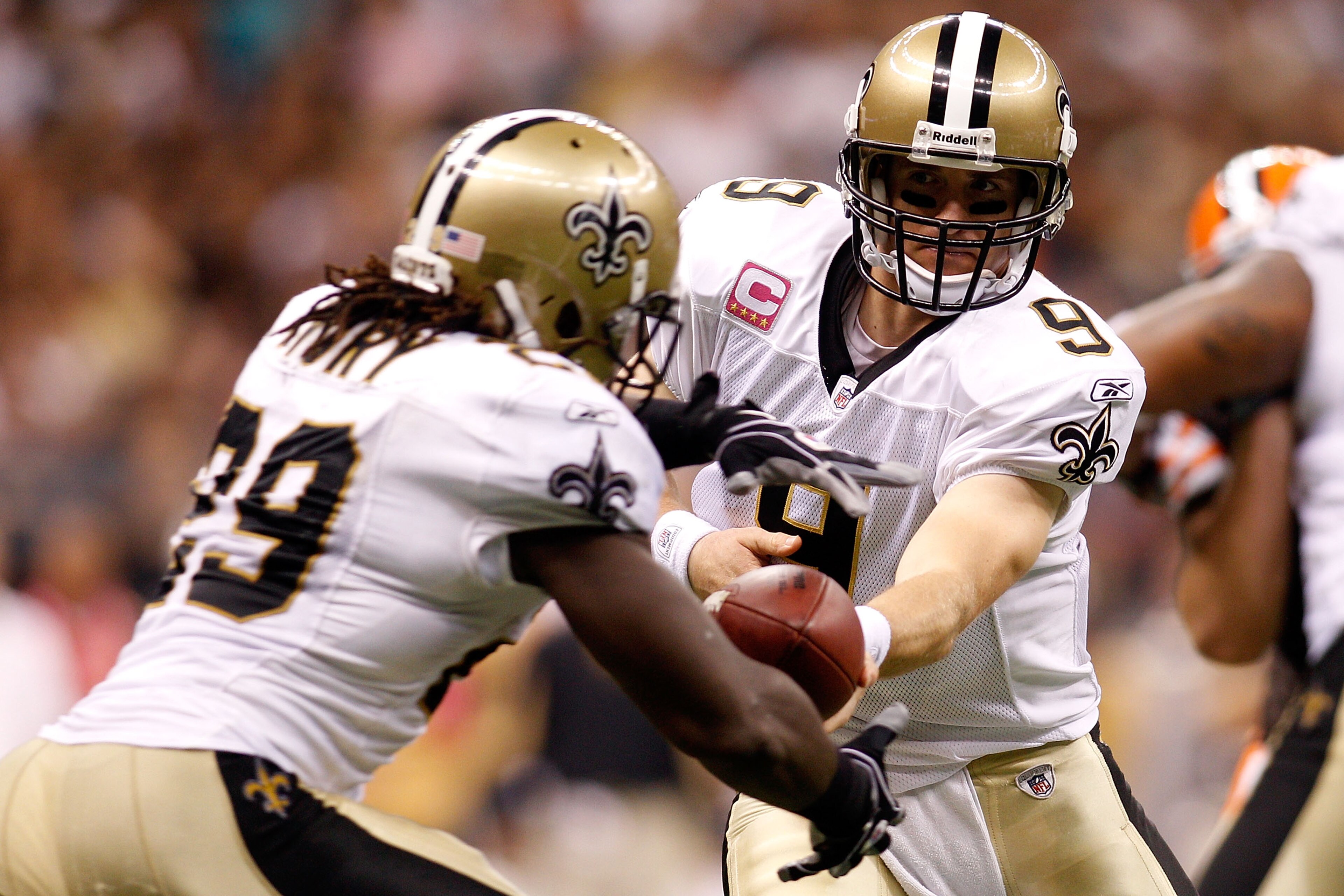NEW ORLEANS - OCTOBER 24: Drew Brees #9 hands off the ball to Chris Ivory #29 of the New Orleans Saints during the game against the Cleveland Browns at the Louisiana Superdome on October 24, 2010 in New Orleans, Louisiana. The Browns defeated the Saints NEW ORLEANS - OCTOBER 24: Drew Brees #9 hands off the ball to Chris Ivory #29 of the New Orleans Saints during the game against the Cleveland Browns at the Louisiana Superdome on October 24, 2010 in New Orleans, Louisiana. The Browns defeated the Saints