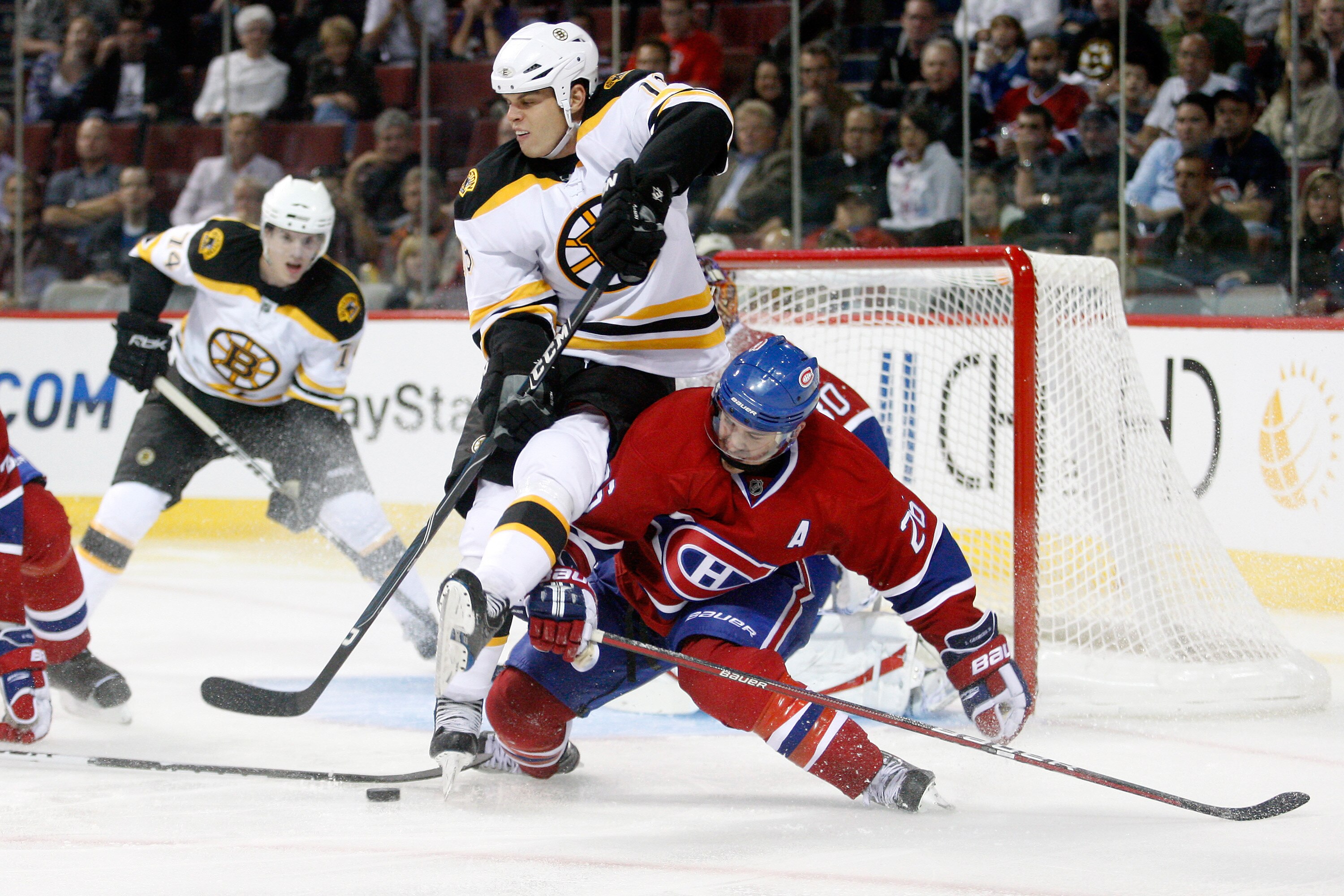 MONTREAL, CANADA - SEPTEMBER 22:  Nathan Horton #18 of the Boston Bruins falls over Josh Gorges #26 of the Montreal Canadiens during an NHL preseason game at the Bell Centre on September 22, 2010 in Montreal, Quebec, Canada.  The Bruins defeated the Canad