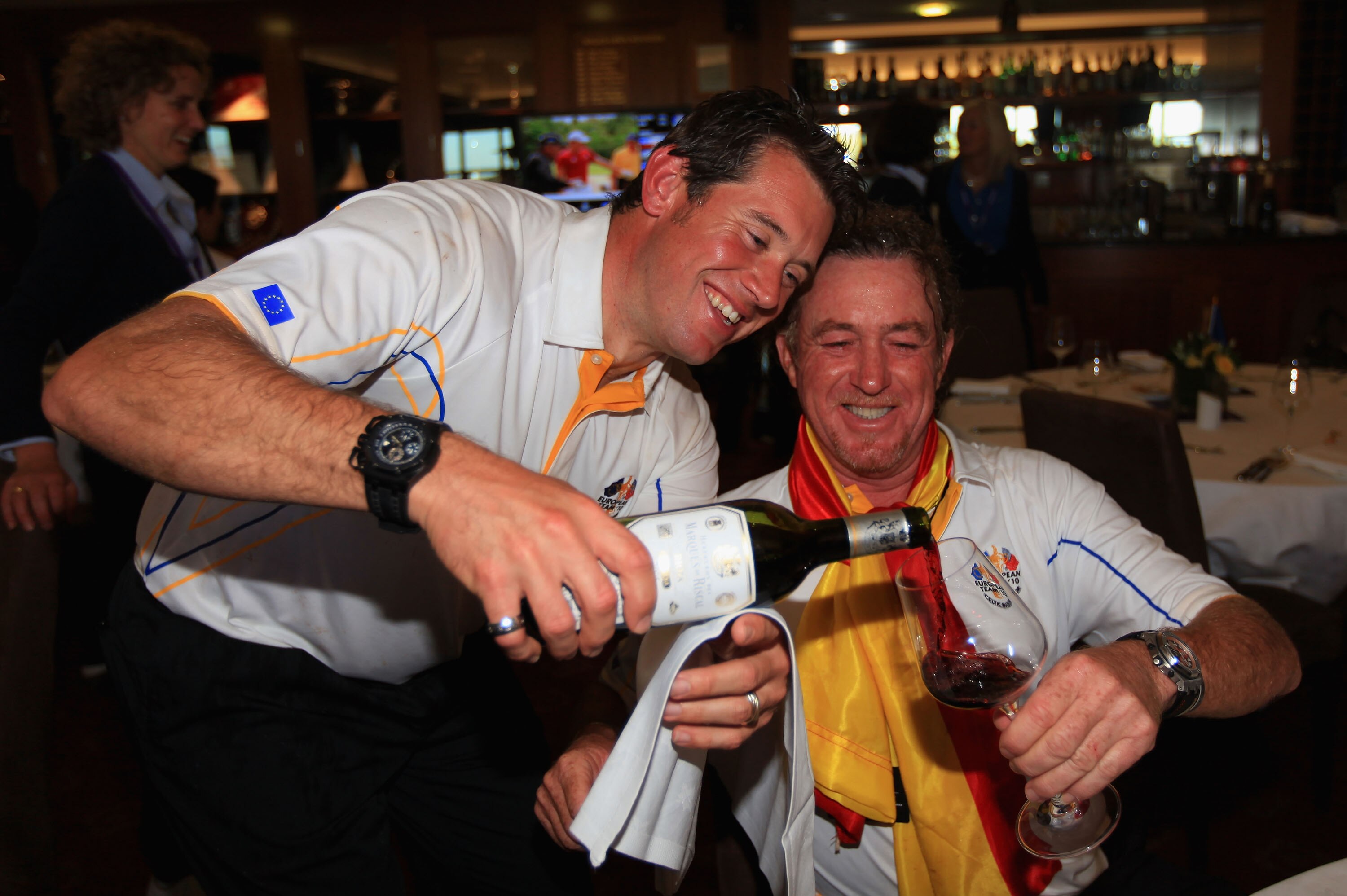 NEWPORT, WALES - OCTOBER 04:  (L-R) Lee Westwood and Miguel Angel Jimenez of Europe celebrate with a glass of wine following Europe's victory in the 2010 Ryder Cup at the Celtic Manor Resort on October 4, 2010 in Newport, Wales.  (Photo by David Cannon/Ge