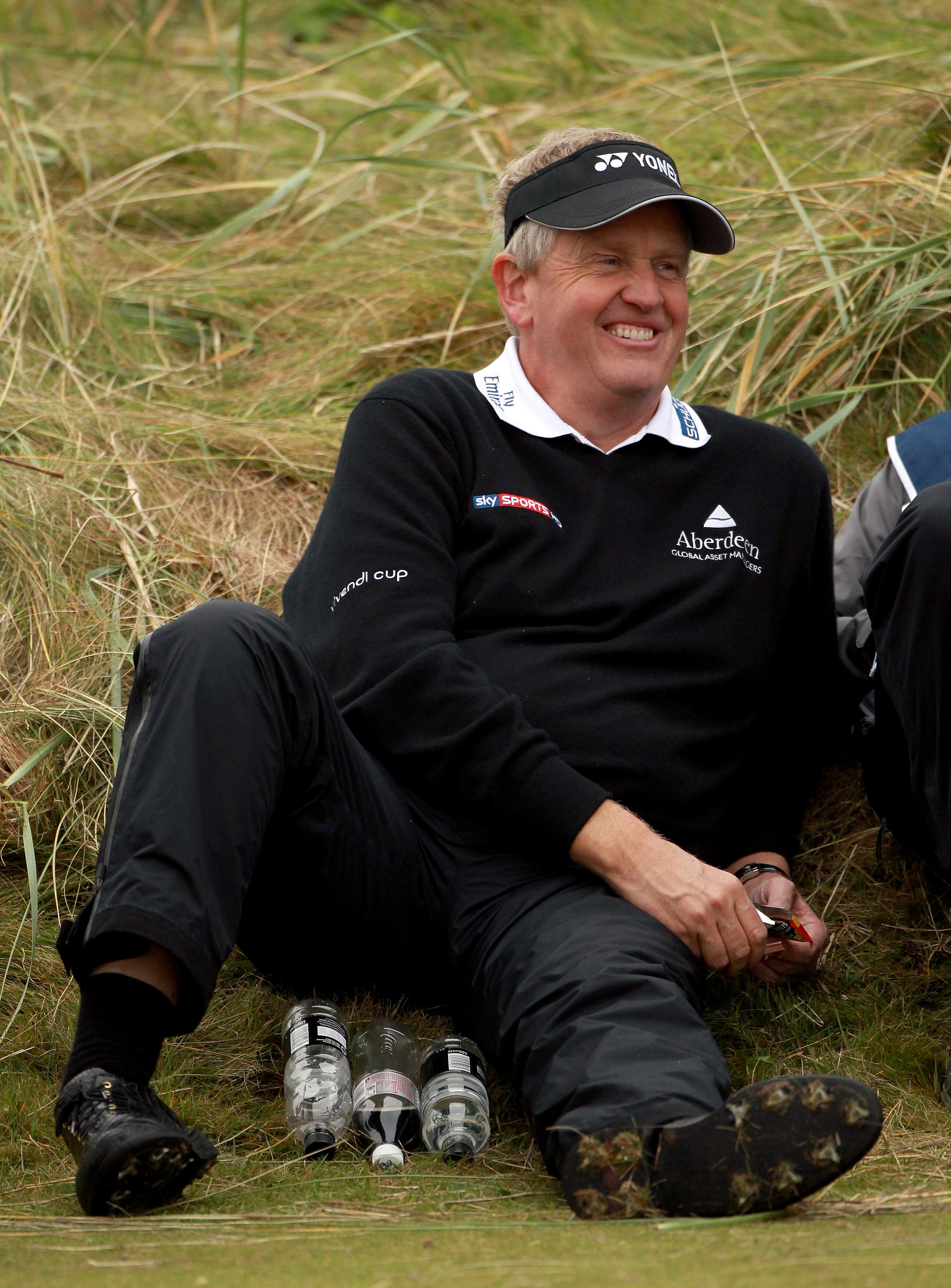 CARNOUSTIE, SCOTLAND - OCTOBER 09:  Colin Montgomerie of Scotland takes a break whilst he waits to play on the sixth tee during the third round of The Alfred Dunhill Links Championship at the Carnoustie Golf Links on October 9, 2010 in Carnoustie, Scotlan