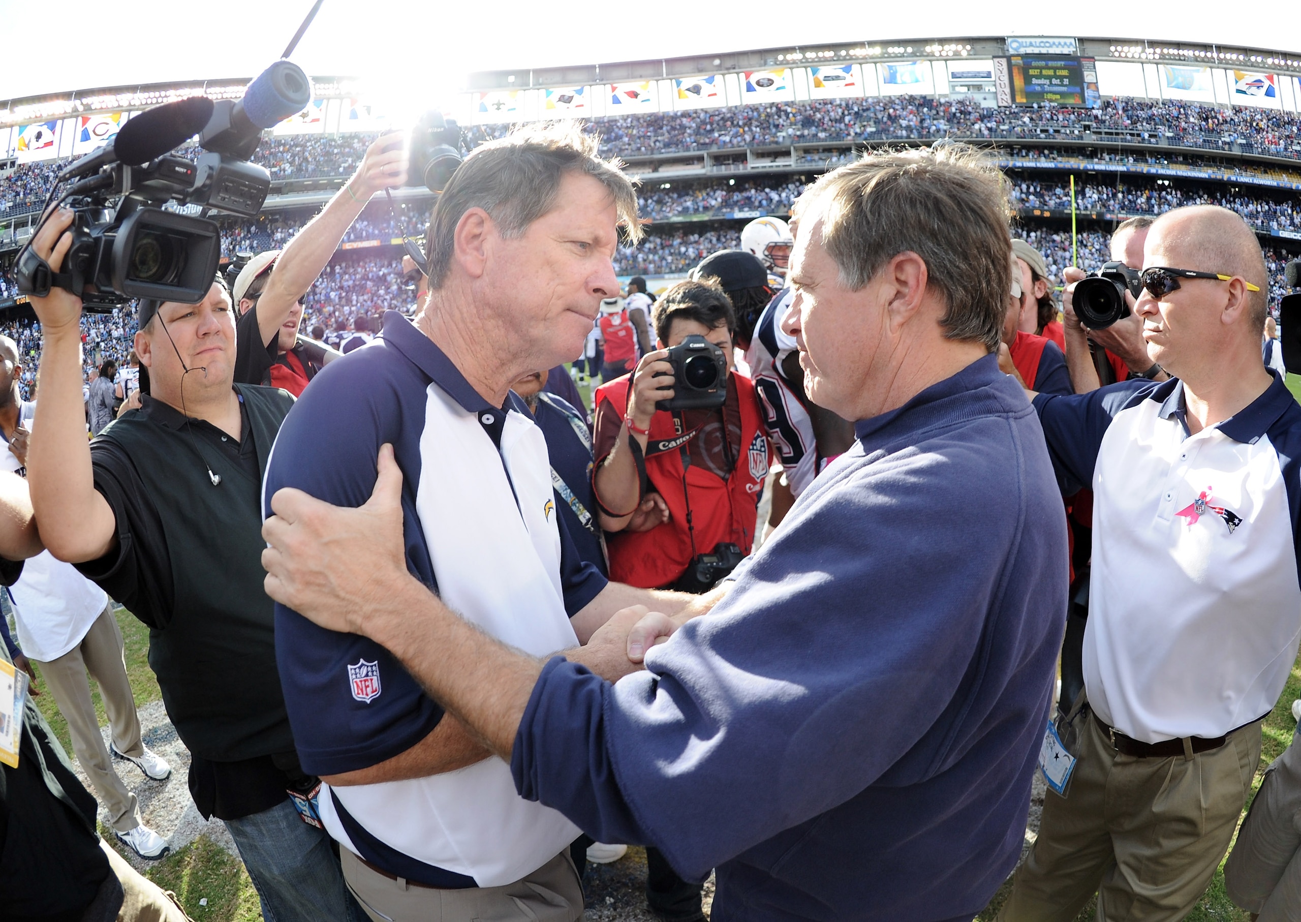 SAN DIEGO - OCTOBER 24:  Head Coaches Bill Belichick of the New England Patriots and Norv Turner of the San Diego Chargers greet each other at the end of the game after a 23-20 win by the Patriots at Qualcomm Stadium on October 24, 2010 in San Diego, Cali