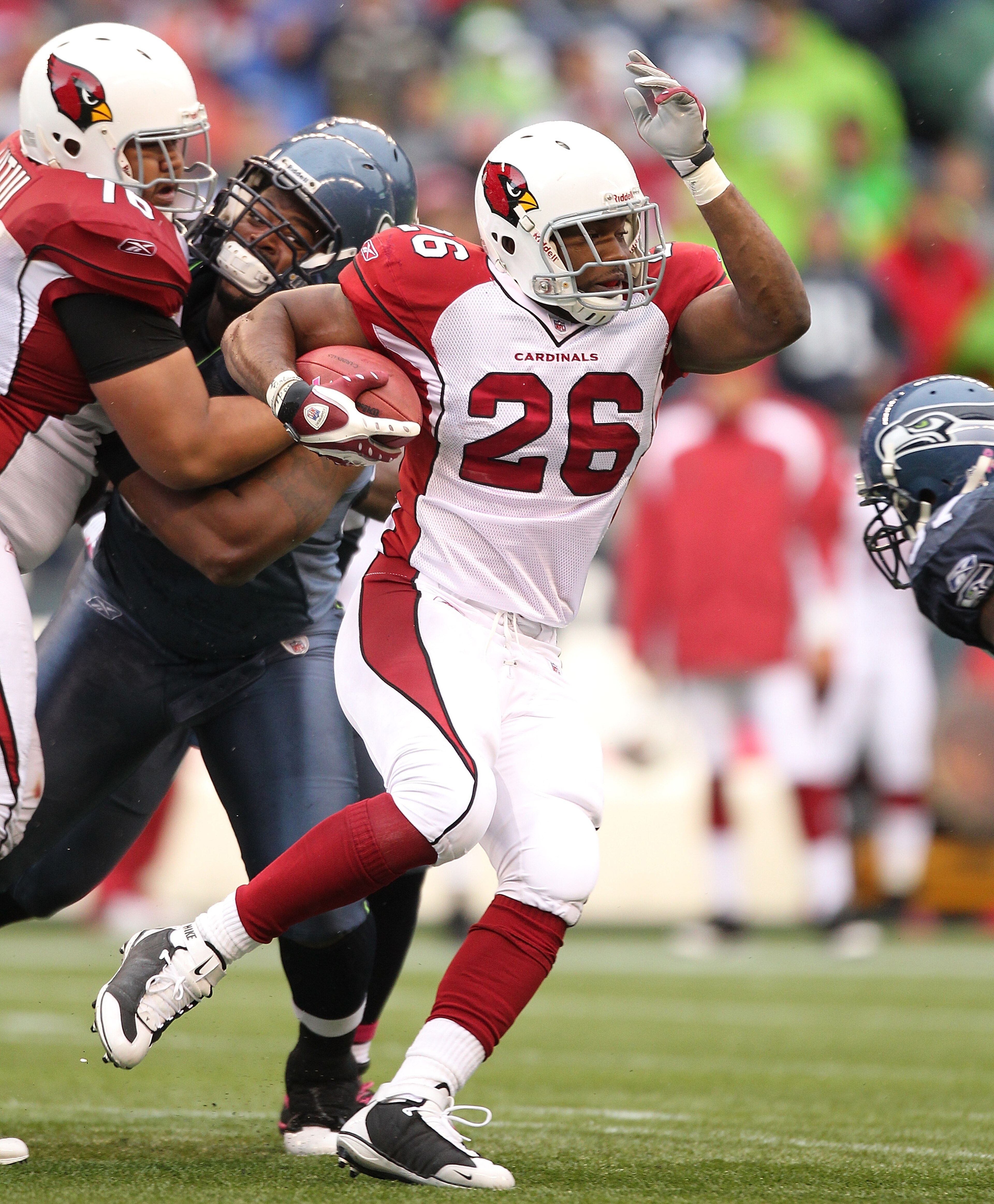 SEATTLE - OCTOBER 24: Running back Beanie Wells #26 of the Arizona Cardinals rushes against the Seattle Seahawks at Qwest Field on October 24, 2010 in Seattle, Washington. (Photo by Otto Greule Jr/Getty Images) SEATTLE - OCTOBER 24: Running back Beanie Wells #26 of the Arizona Cardinals rushes against the Seattle Seahawks at Qwest Field on October 24, 2010 in Seattle, Washington. (Photo by Otto Greule Jr/Getty Images)