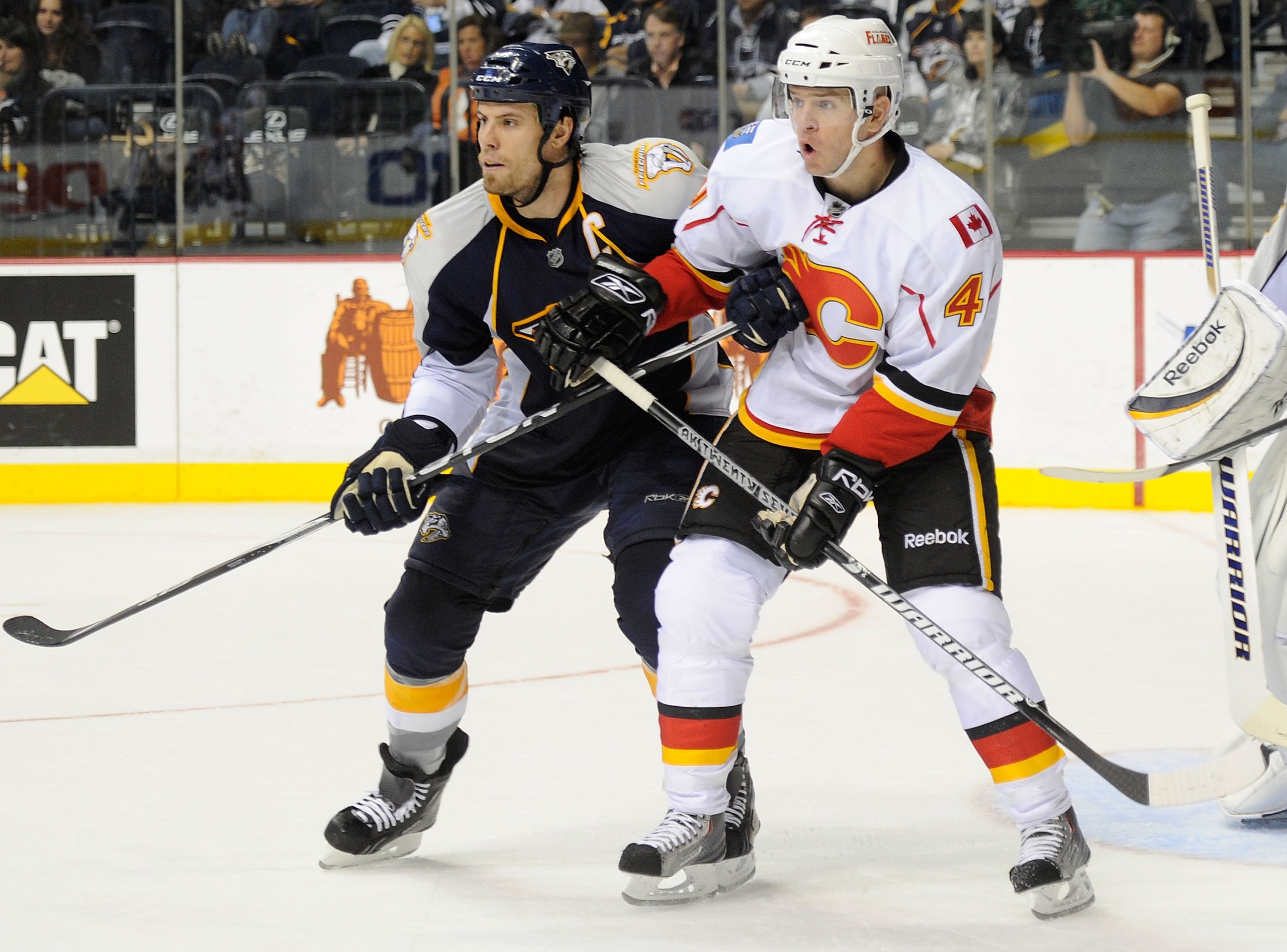 NASHVILLE, TN - OCTOBER 19:  Defenseman Shea Webe #6 of the Nashville Predators defends left wing Alex Tanguay #40 of the Calgary Flames on October 19, 2010 in Nashville, Tennessee.  (Photo by Frederick Breedon/Getty Images)