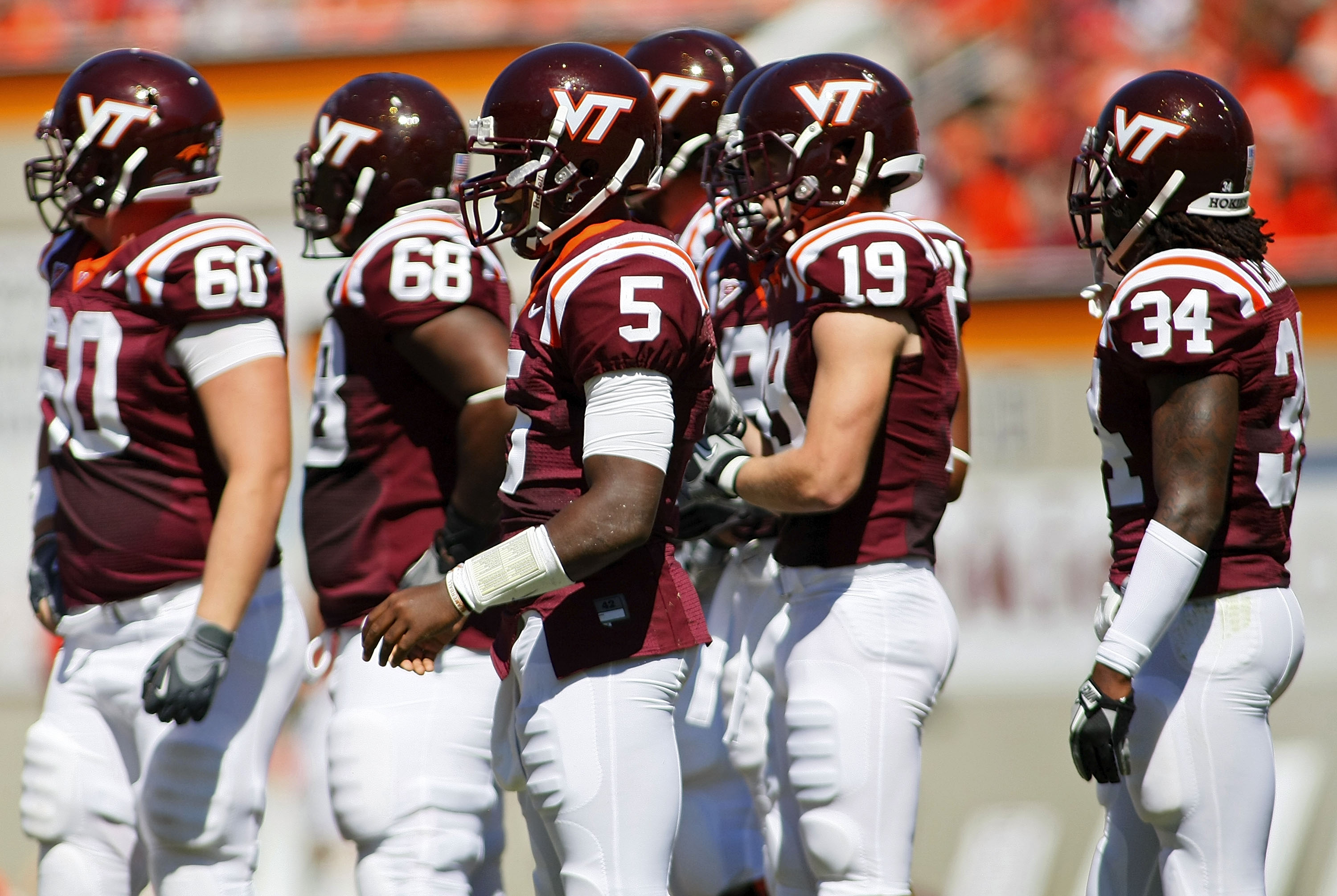 BLACKSBURG, VA - SEPTEMBER 18: Quarterback Tyrod Taylor #5 of the Virginia Tech Hokies stands on field with other members of the Hokies offense during a timeout against the East Carolina Pirates at Lane Stadium on September 18, 2010 in Blacksburg, Virgini