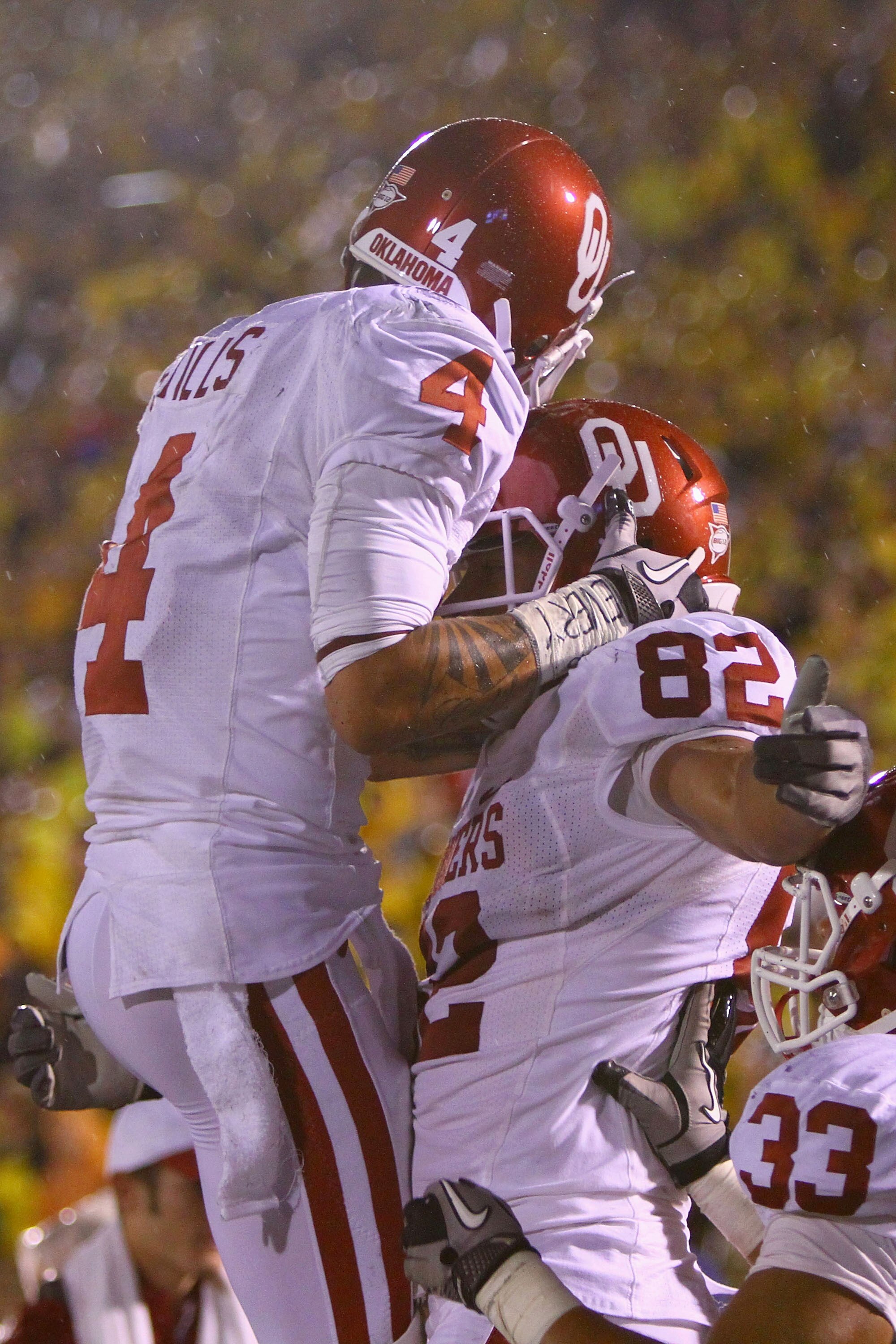 COLUMBIA, MISSOURI - OCTOBER 23: James Hanna #82 and Kenny Stills #4 both of the Oklahoma Sooners celebrate Hanna's touchdown against the Missouri Tigers Faurot Field/Memorial Stadium on October 23, 2010 in Columbia, Missouri.  The Tigers beat the Sooners