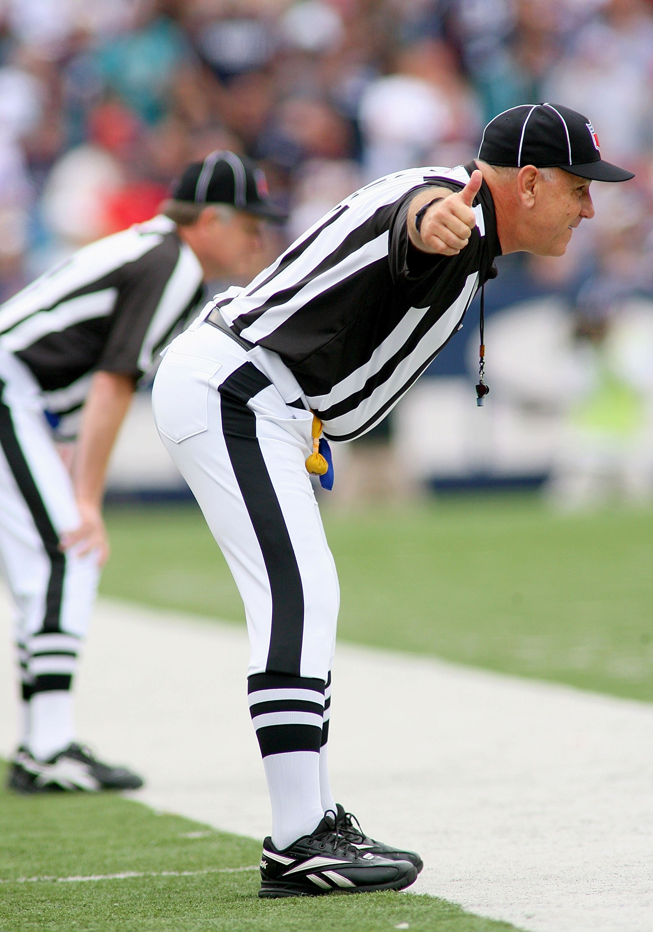 ORCHARD PARK, NY - SEPTEMBER 12: Officials ready to watch a play between the Buffalo Bills and the Miami Dolphins during the NFL season opener at Ralph Wilson Stadium on September 12, 2010 in Orchard Park, New York. The Dolphins won 15-10. (Photo by Rick