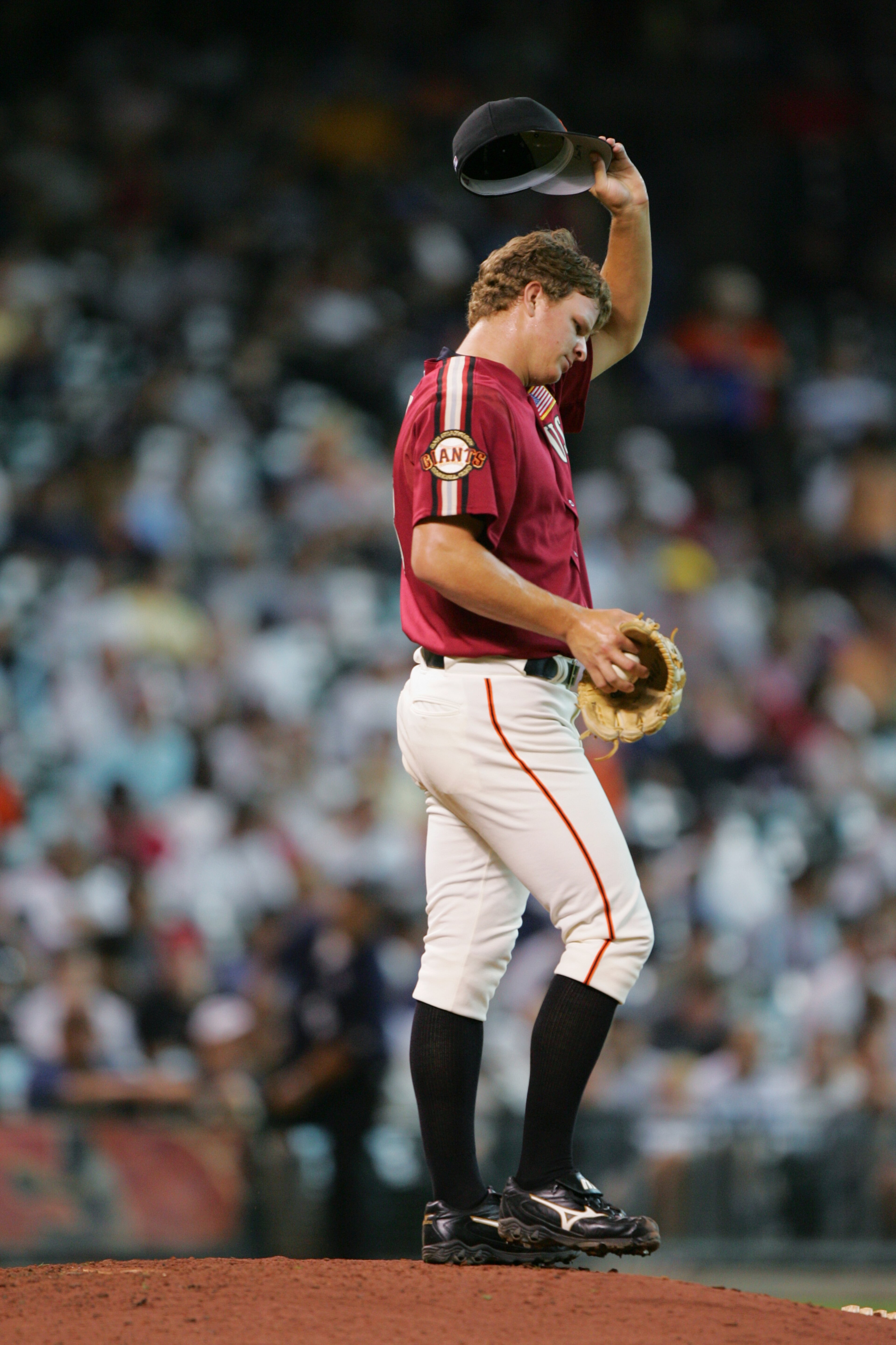 HOUSTON - JULY 11:  Matt Cain of the USA team wipes his forehead before pitching against the World team during the Major League Baseball Futures Game at Minute Maid Park on July 11, 2004 in Houston, Texas.  The USA team defeated the World team in seven in