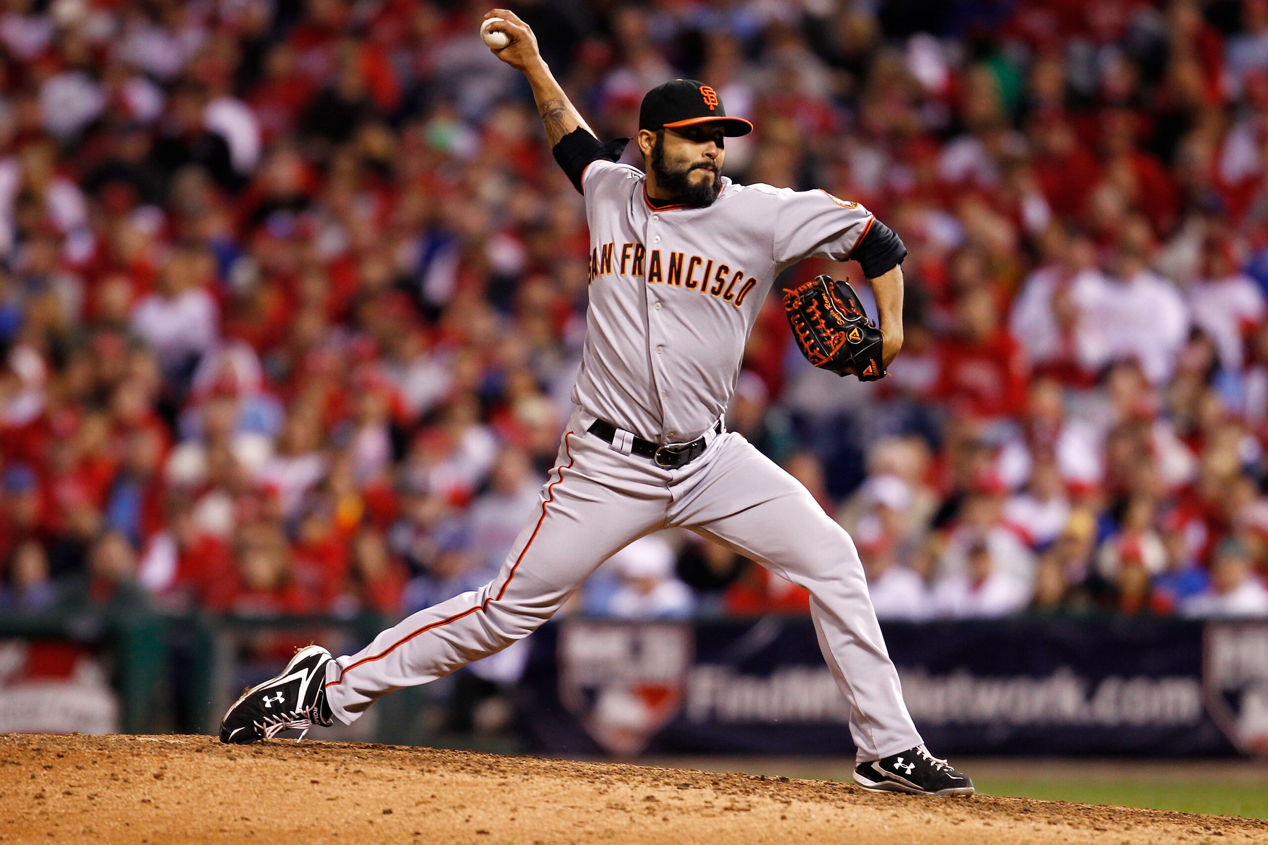 PHILADELPHIA - OCTOBER 17:  Sergio Romo #54 of the San Francisco Giants pitches against the Philadelphia Phillies in Game Two of the NLCS during the 2010 MLB Playoffs at Citizens Bank Park on October 17, 2010 in Philadelphia, Pennsylvania.  (Photo by Jeff