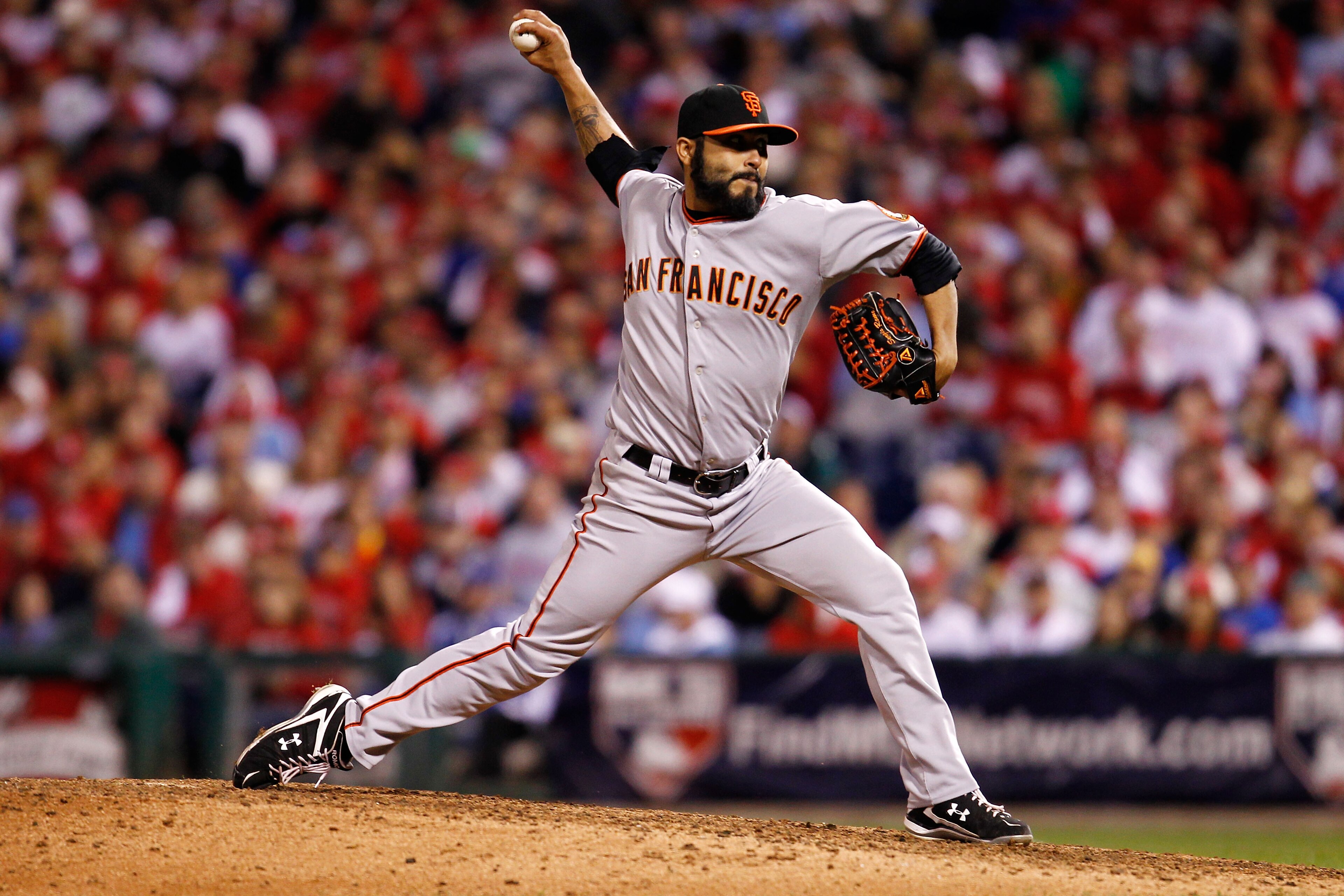 PHILADELPHIA - OCTOBER 17:  Sergio Romo #54 of the San Francisco Giants pitches against the Philadelphia Phillies in Game Two of the NLCS during the 2010 MLB Playoffs at Citizens Bank Park on October 17, 2010 in Philadelphia, Pennsylvania.  (Photo by Jeff