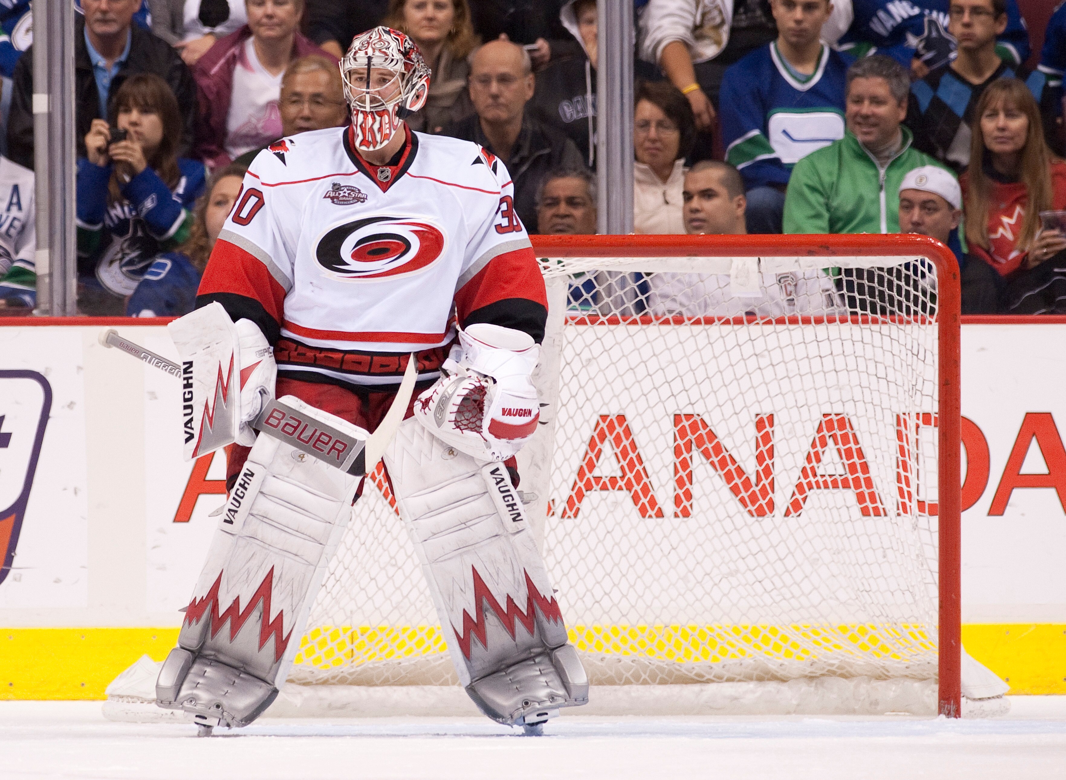 VANCOUVER, CANADA - OCTOBER 17: Goalie Cam Ward #30 of the Carolina Hurricanes keeps an eye on the play during NHL action against the Vancouver Canucks on October 17, 2010 at Rogers Arena in Vancouver, British Columbia, Canada.  (Photo by Rich Lam/Getty I