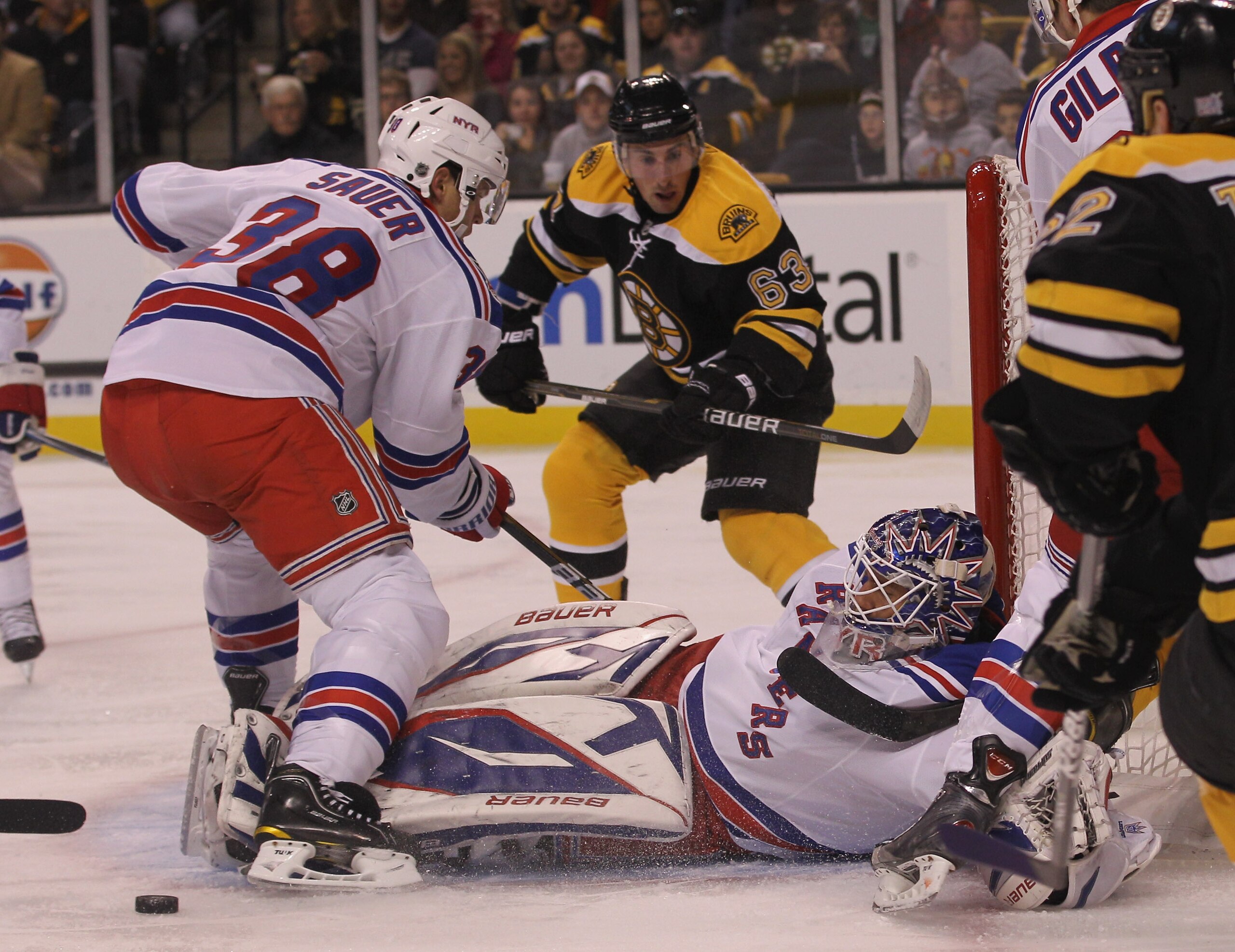 BOSTON - OCTOBER 23: Henrik Lundqvist #30 of the New York Rangers makes the stop as Brad Marchand #63 of the Boston Bruins looks for a rebound at the TD Garden on October 23, 2010 in Boston, Massachusetts. (Photo by Bruce Bennett/Getty Images) BOSTON - OCTOBER 23: Henrik Lundqvist #30 of the New York Rangers makes the stop as Brad Marchand #63 of the Boston Bruins looks for a rebound at the TD Garden on October 23, 2010 in Boston, Massachusetts. (Photo by Bruce Bennett/Getty Images)