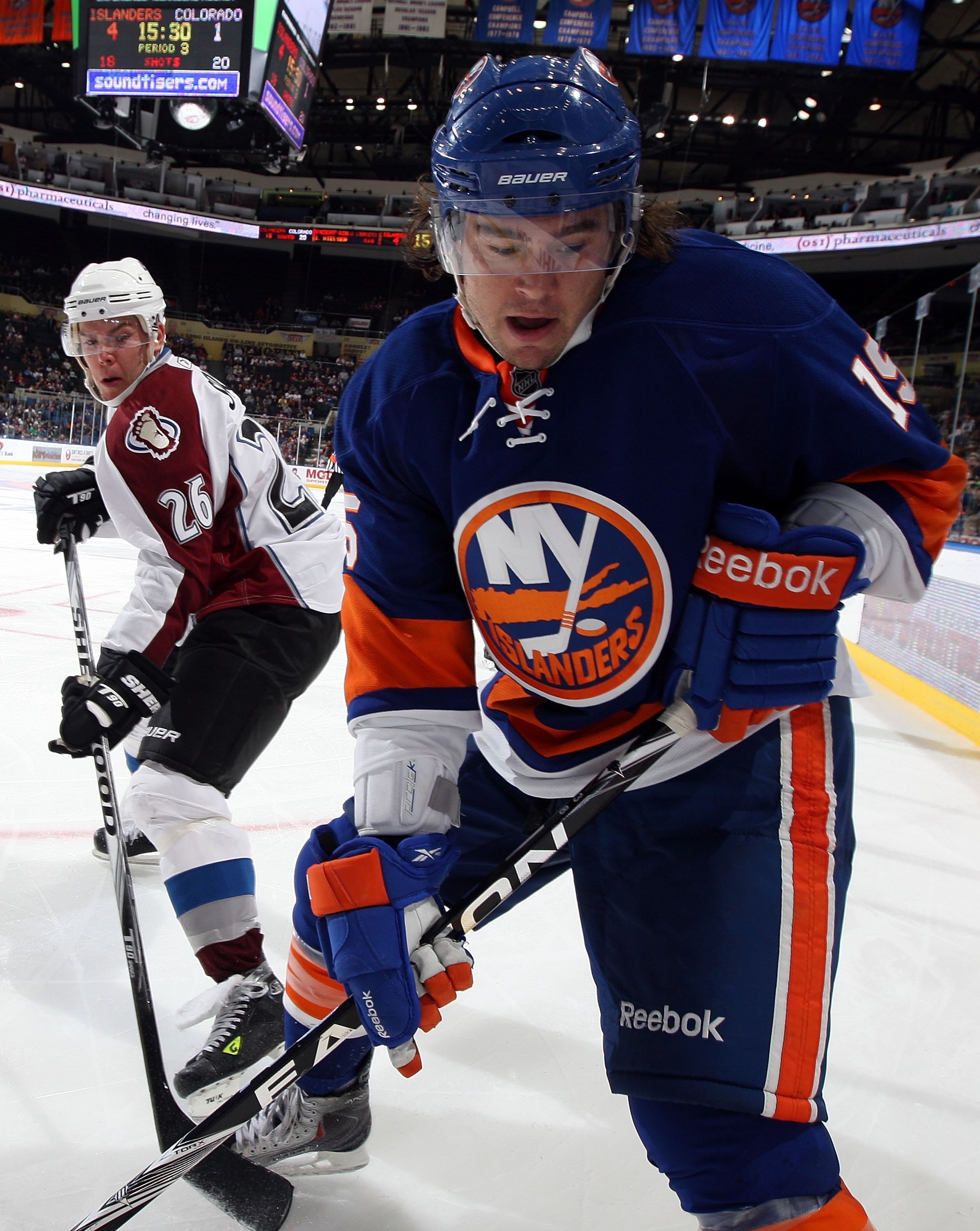 UNIONDALE, NY - OCTOBER 16:  PA Parenteau #15 of the New York Islanders skates against Paul Stastny #26 of the Colorado Avalanche on October 16, 2010 at Nassau Coliseum in Uniondale, New York.  (Photo by Jim McIsaac/Getty Images)