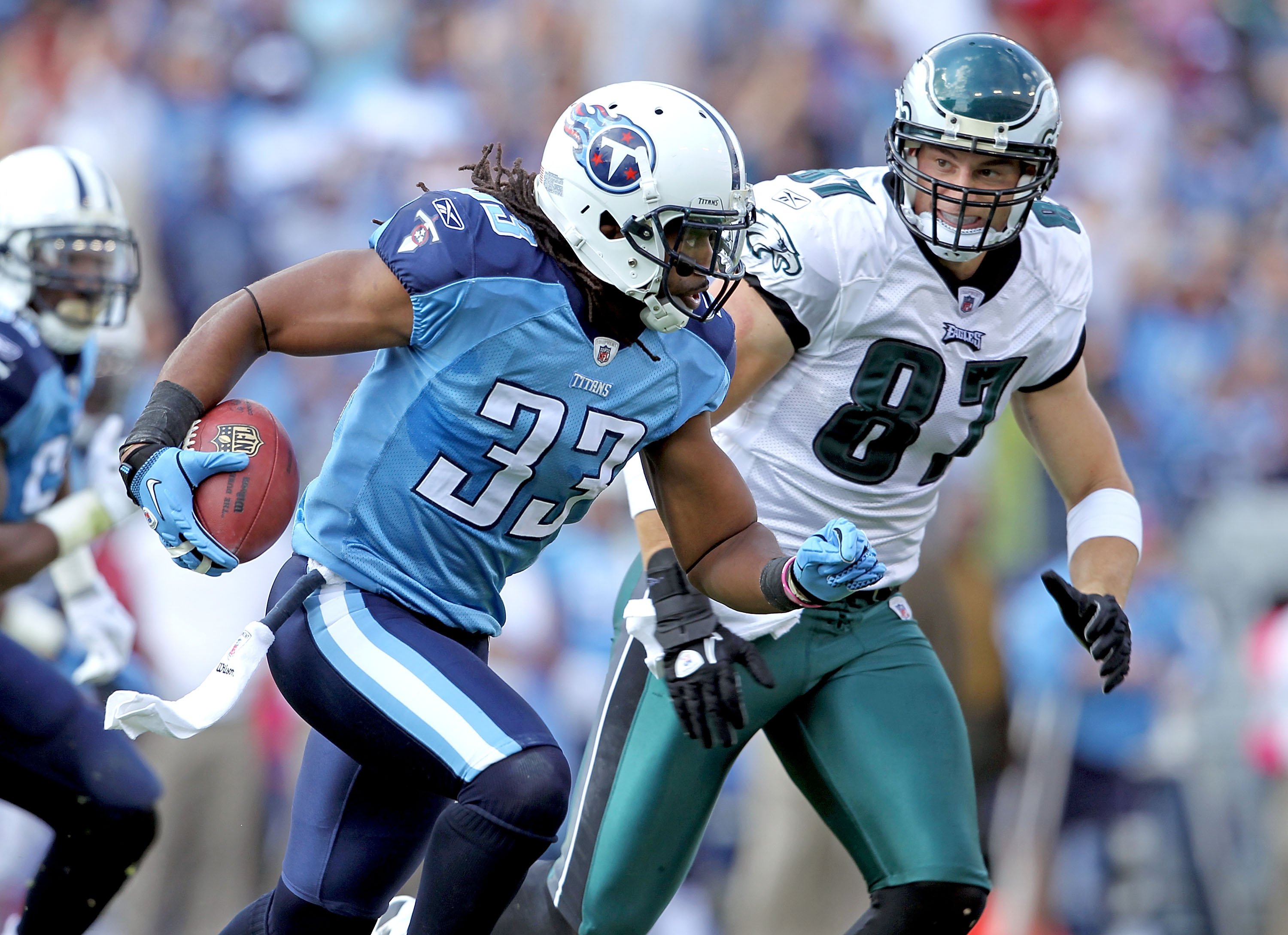 NASHVILLE, TN - OCTOBER 24: Michael Griffin #33 of the Tennessee Titans runs with the ball after intercepting a pass while defended by Brent Celek #87 of the Philadelphia Eagles at LP Field on October 24, 2010 in Nashville, Tennessee. The Titans won 37-19