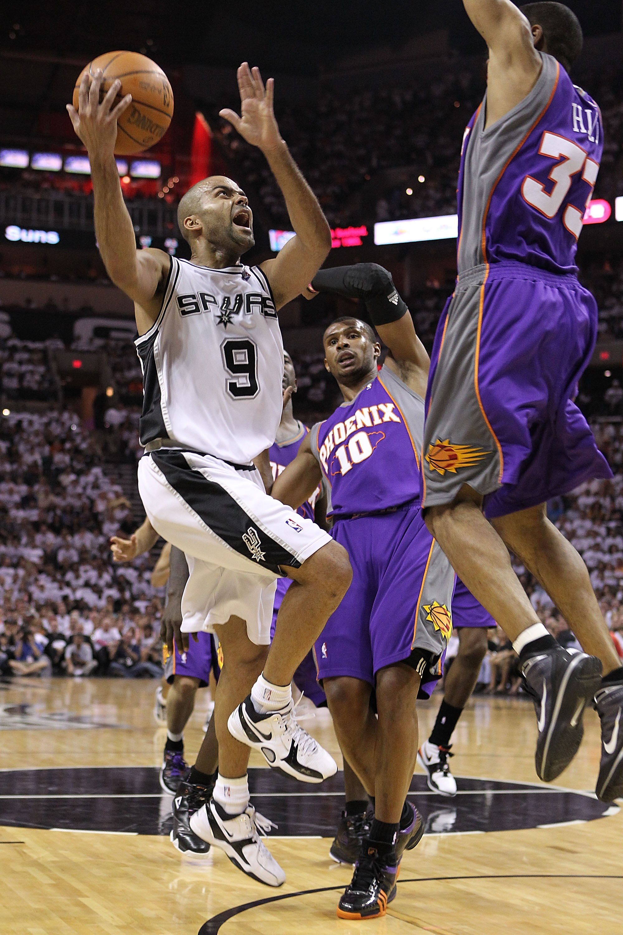 SAN ANTONIO - MAY 07:  Guard Tony Parker #9 of the San Antonio Spurs takes a shot against Grant Hill #33 of the Phoenix Suns in Game Three of the Western Conference Semifinals during the 2010 NBA Playoffs at AT&T Center on May 7, 2010 in San Antonio, Texa