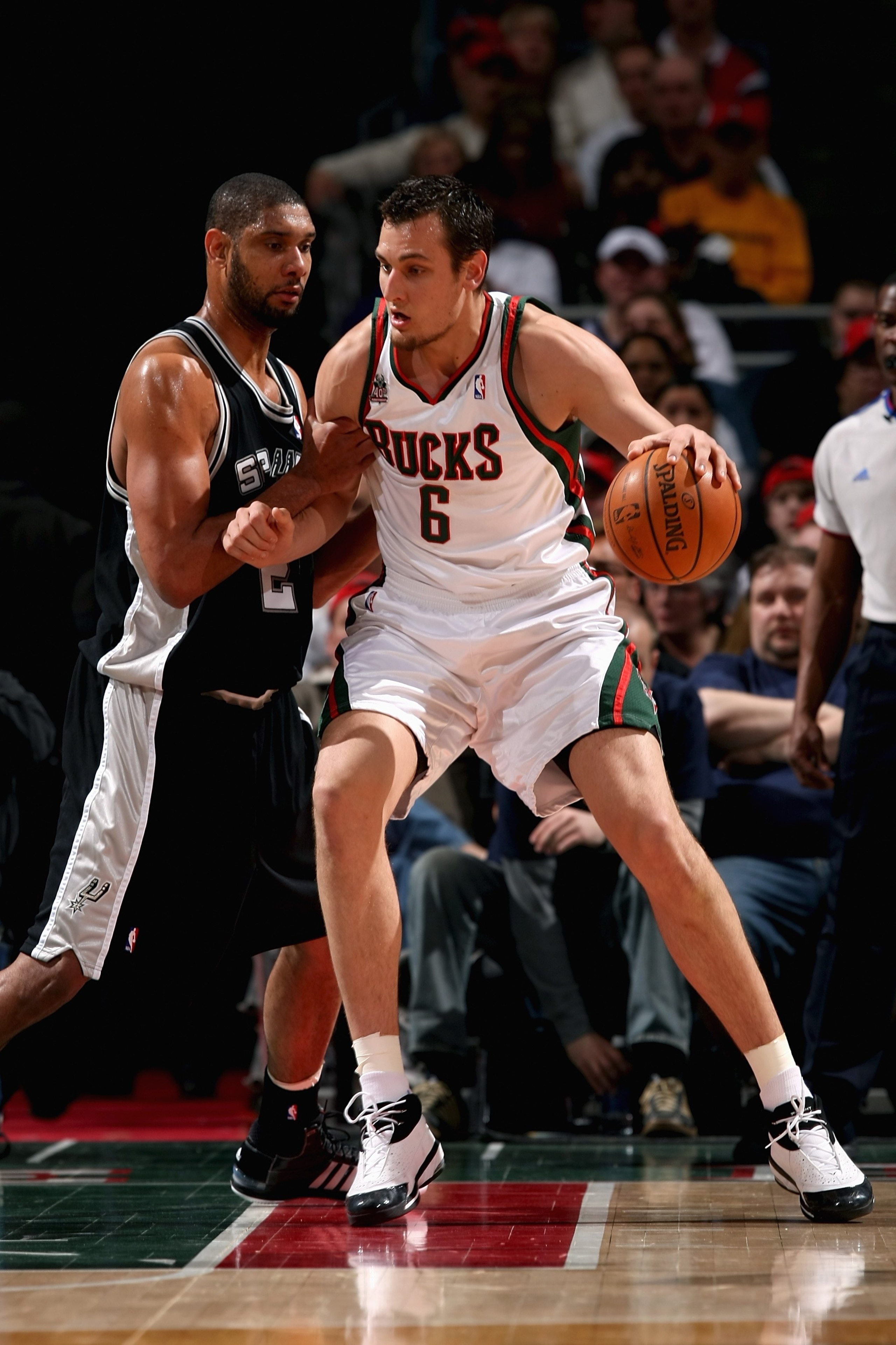 MILWAUKEE - MARCH 1:  Andrew Bogut #6 of the Milwaukee Bucks goes up against Tim Duncan #21 of the San Antonio Spurs during the game on March 1, 2008 at the Bradley Center in Milwaukee, Wisconsin.  The Spurs 96-94.  NOTE TO USER: User expressly acknowledg