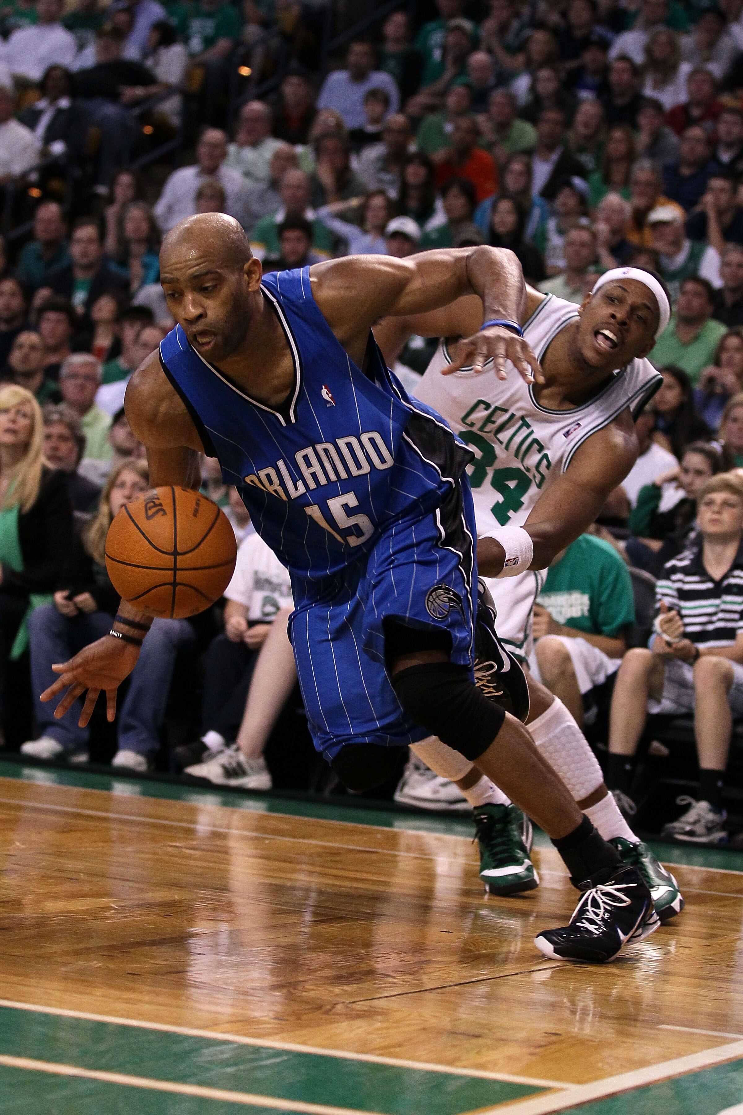 BOSTON - MAY 28:  Vince Carter #15 of the Orlando Magic loses the ball as he drives past Paul Pierce #34 of the Boston Celtics in Game Six of the Eastern Conference Finals during the 2010 NBA Playoffs at TD Garden on May 28, 2010 in Boston, Massachusetts.