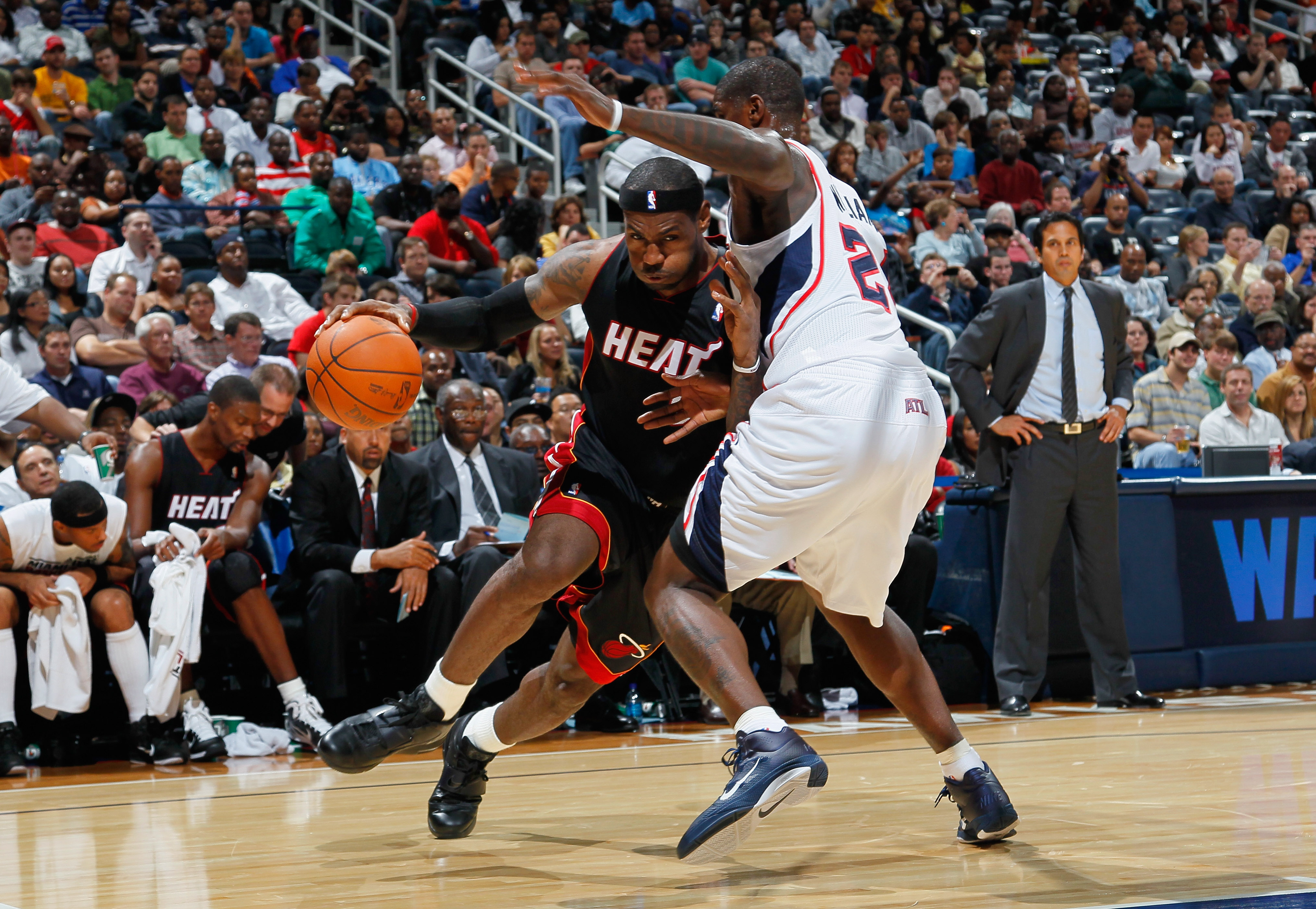 ATLANTA - OCTOBER 21:  LeBron James #6 of the Miami Heat drives the basket against Marvin Williams #24 of the Atlanta Hawks at Philips Arena on October 21, 2010 in Atlanta, Georgia.  (Photo by Kevin C. Cox/Getty Images)