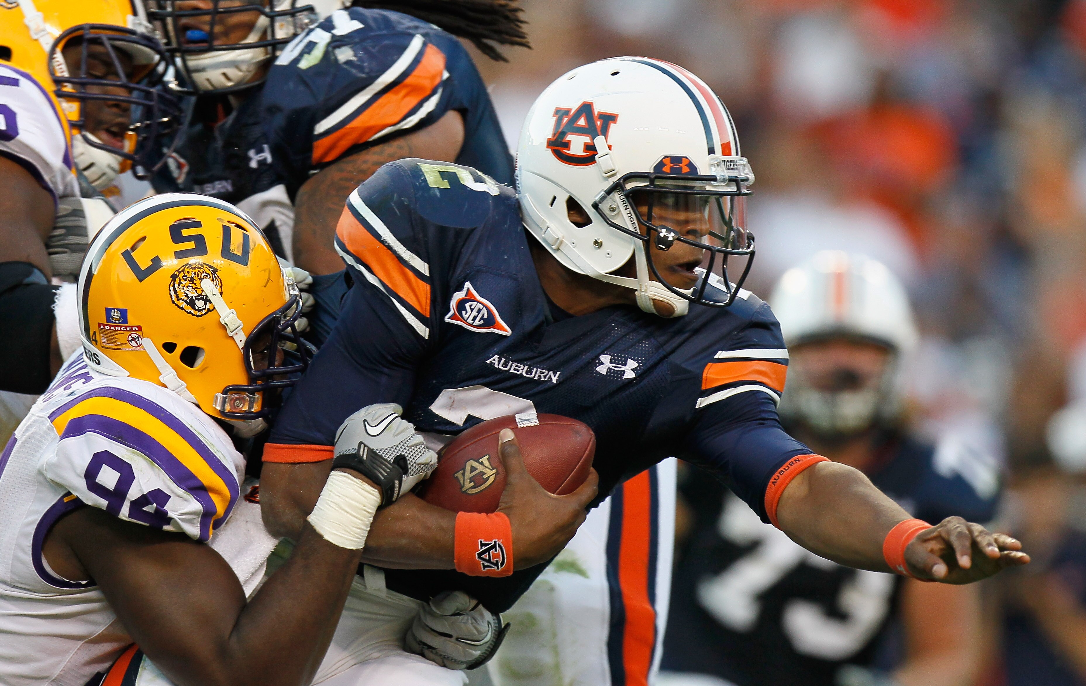 AUBURN, AL - OCTOBER 23: Quarterback Cameron Newton #2 of the Auburn Tigers is tackled by Kendrick Adams #37 of the LSU Tigers at Jordan-Hare Stadium on October 23, 2010 in Auburn, Alabama. (Photo by Kevin C. Cox/Getty Images) AUBURN, AL - OCTOBER 23: Quarterback Cameron Newton #2 of the Auburn Tigers is tackled by Kendrick Adams #37 of the LSU Tigers at Jordan-Hare Stadium on October 23, 2010 in Auburn, Alabama. (Photo by Kevin C. Cox/Getty Images)