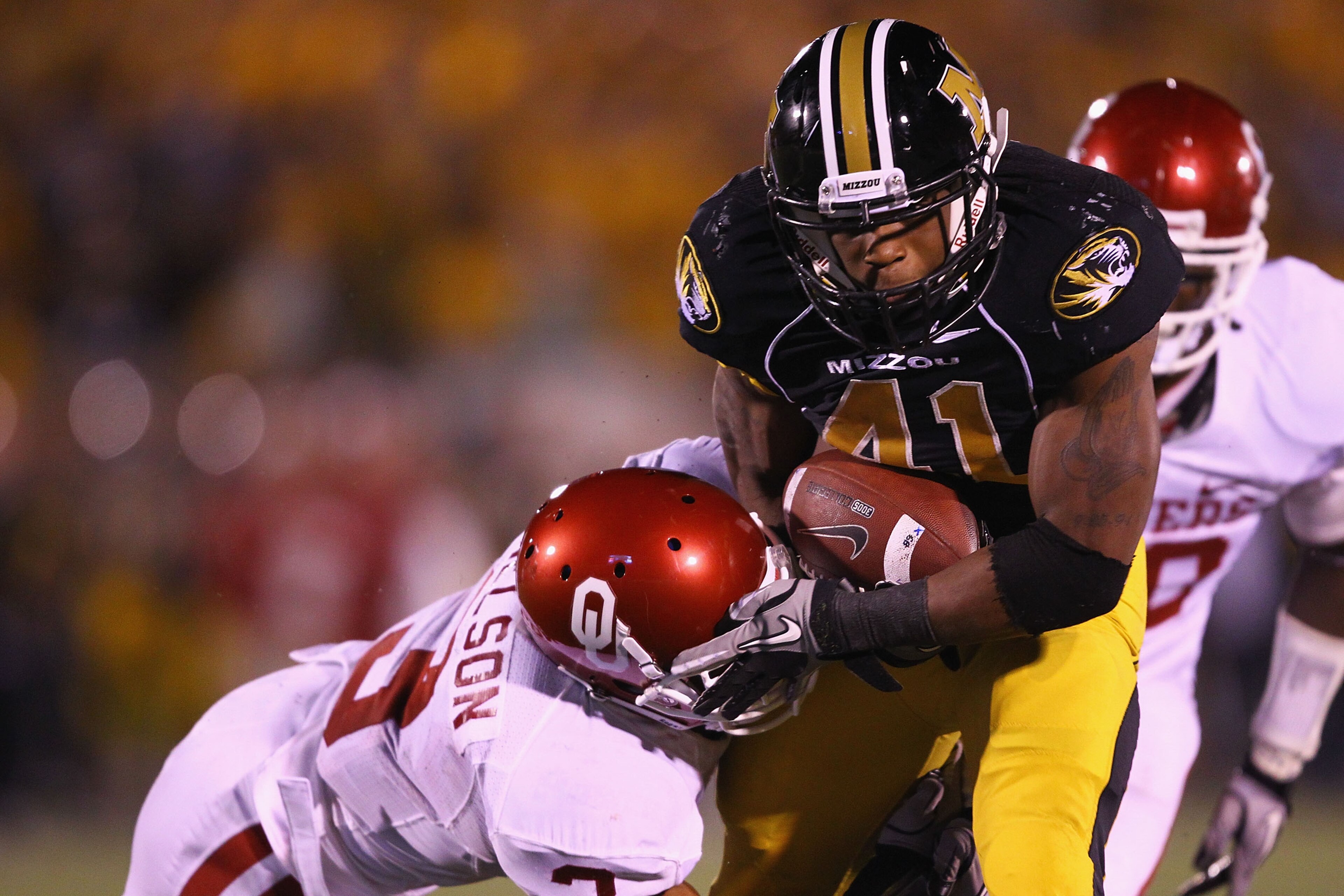 COLUMBIA, MISSOURI - OCTOBER 23: Derrick Washington #24 of the Missouri Tigers looks to get past Jonathan Nelson #3 at Faurot Field/Memorial Stadium on October 23, 2010 in Columbia, Missouri. The Tigers beat the Sooners 36-27. (Photo by Dilip Vishwanat/ COLUMBIA, MISSOURI - OCTOBER 23: Derrick Washington #24 of the Missouri Tigers looks to get past Jonathan Nelson #3 at Faurot Field/Memorial Stadium on October 23, 2010 in Columbia, Missouri. The Tigers beat the Sooners 36-27. (Photo by Dilip Vishwanat/