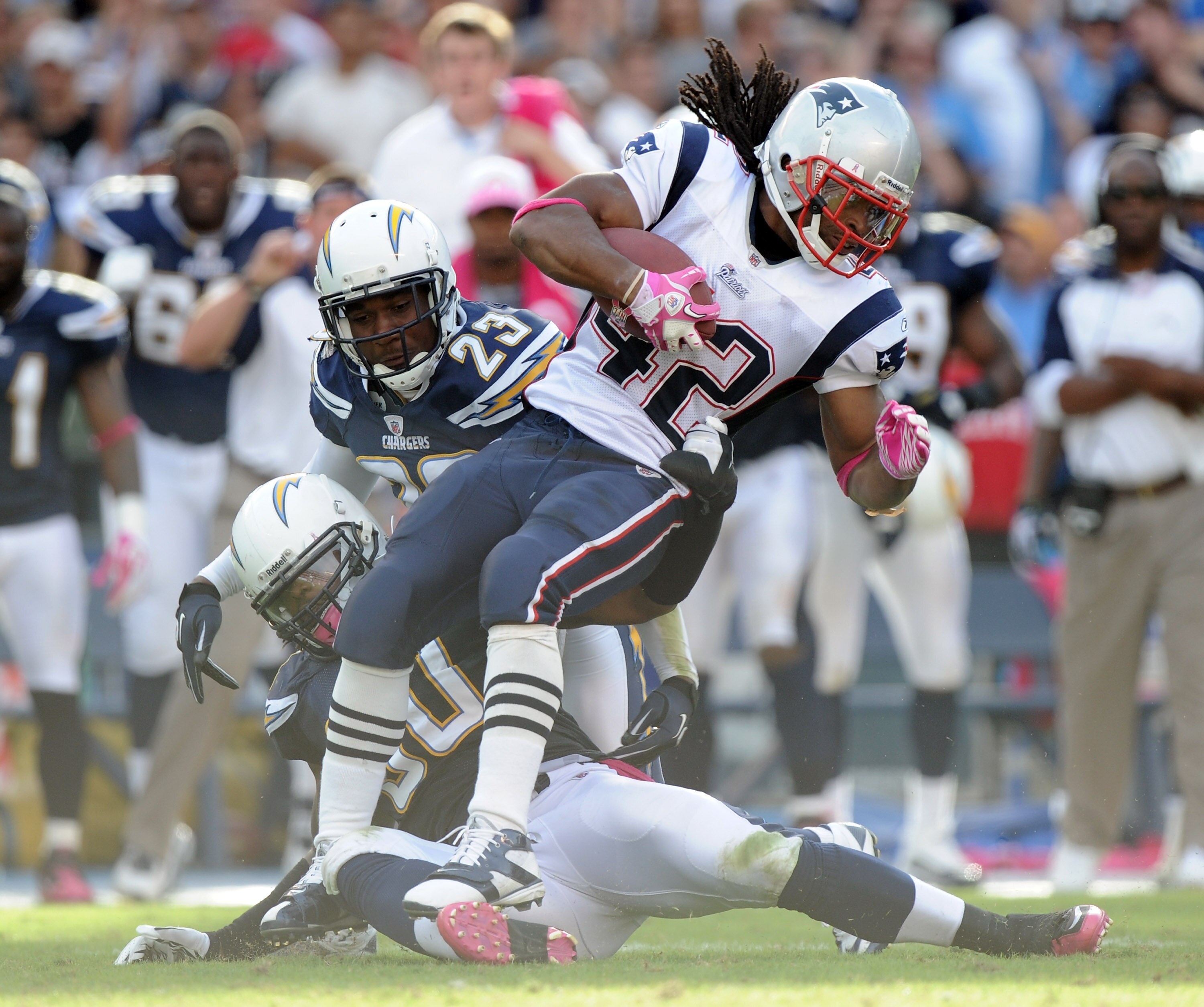 SAN DIEGO - OCTOBER 24:  BenJarvus Green-Ellis of the New England Patriots is stopped on fourth and one by Antwan Applewhite #90 and Quentin Jammer #23 of the San Diego Chargers during the fourth quarter at Qualcomm Stadium on October 24, 2010 in San Dieg