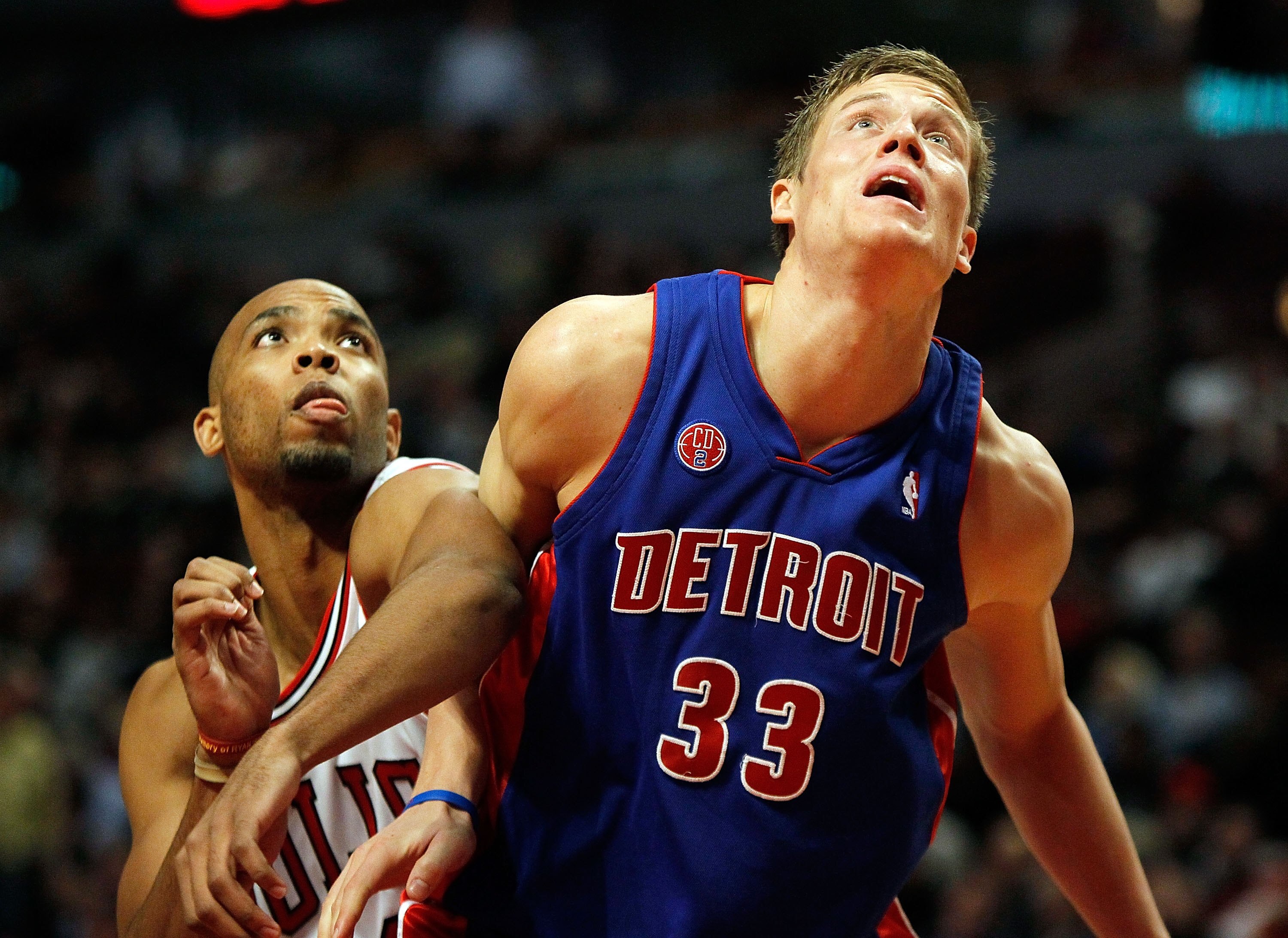 CHICAGO - DECEMBER 02: Jonas Jerebko #33 of the Detroit Pistons boxes out against Taj Gibson #22 of the Chicago Bulls at the United Center on December 2, 2009 in Chicago, Illinois. The Bulls defeated the Pistons 92-85. NOTE TO USER: User expressly acknowl