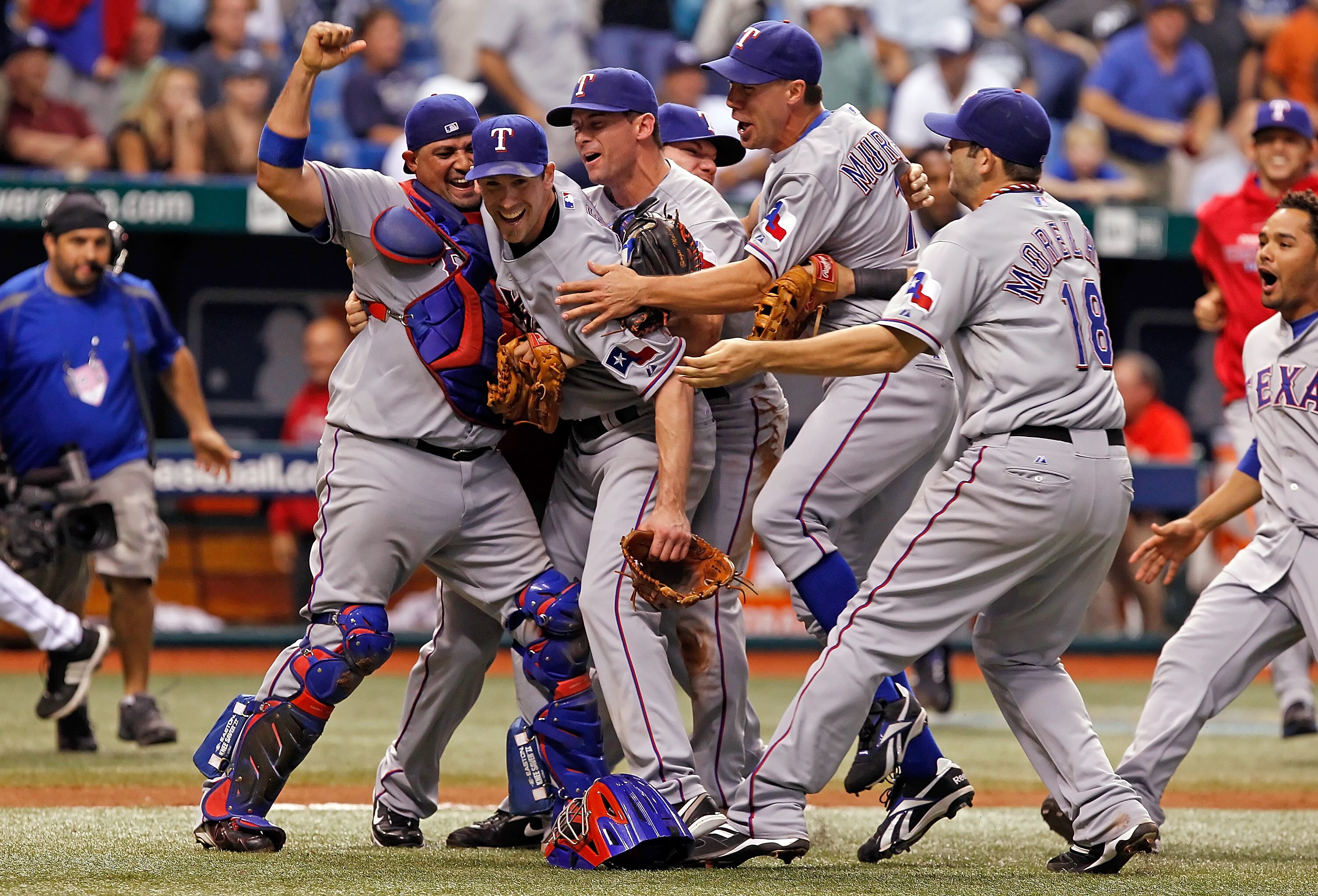 ST PETERSBURG, FL - OCTOBER 12:  Pitcher Cliff Lee #33 (2ndL) of the Texas Rangers celebrates his team's victory over the Tampa Bay Rays in Game 5 of the ALDS at Tropicana Field on October 12, 2010 in St. Petersburg, Florida.  (Photo by J. Meric/Getty Ima