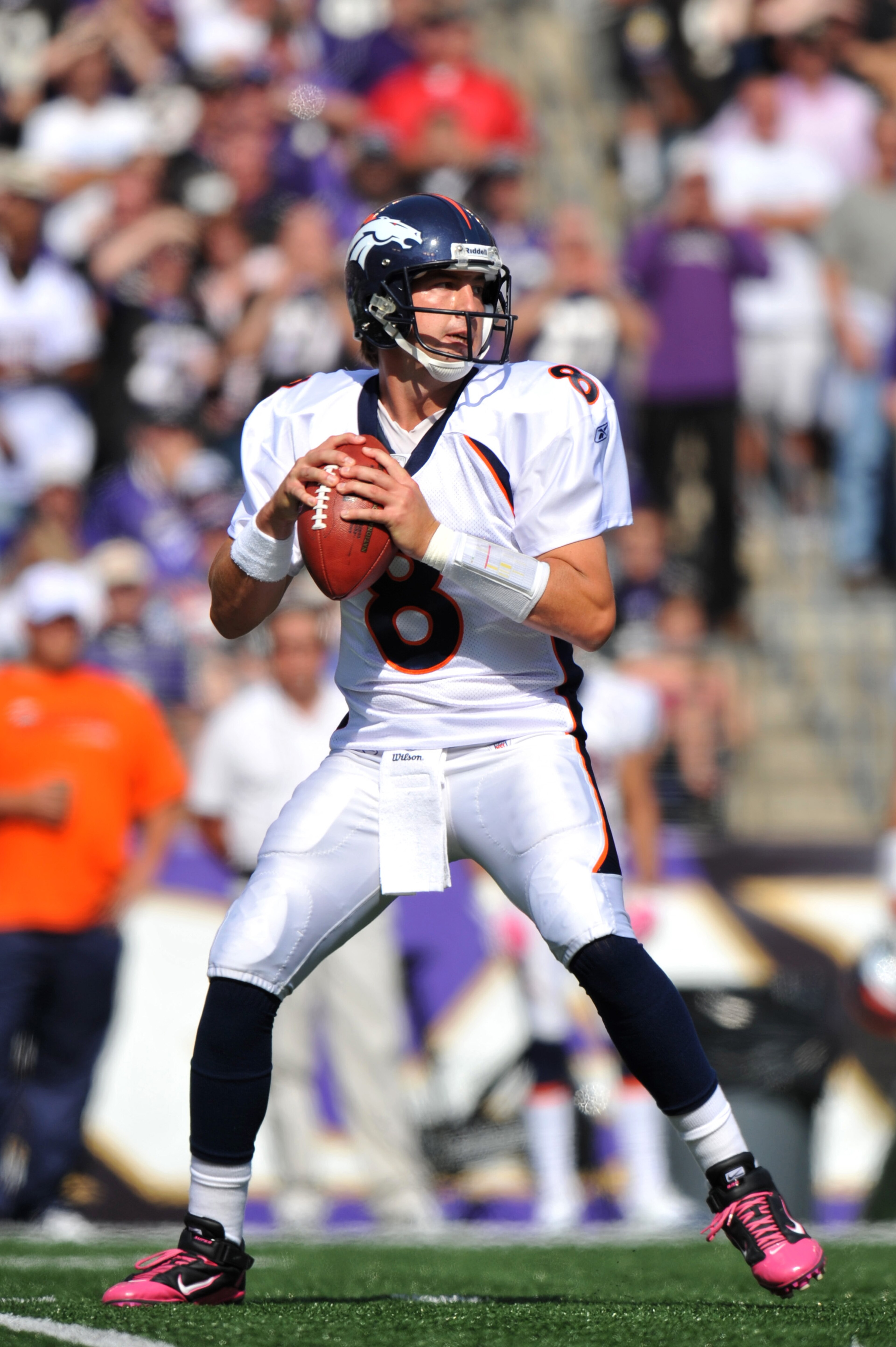 BALTIMORE, MD - OCTOBER 10: Kyle Orton #8 of the Denver Broncos passes against the Baltimore Ravens at M&T Bank Stadium on October 10, 2010 in Baltimore, Maryland. Players wore pink in recognition of Breast Cancer Awareness Month. The Ravens defeated the 