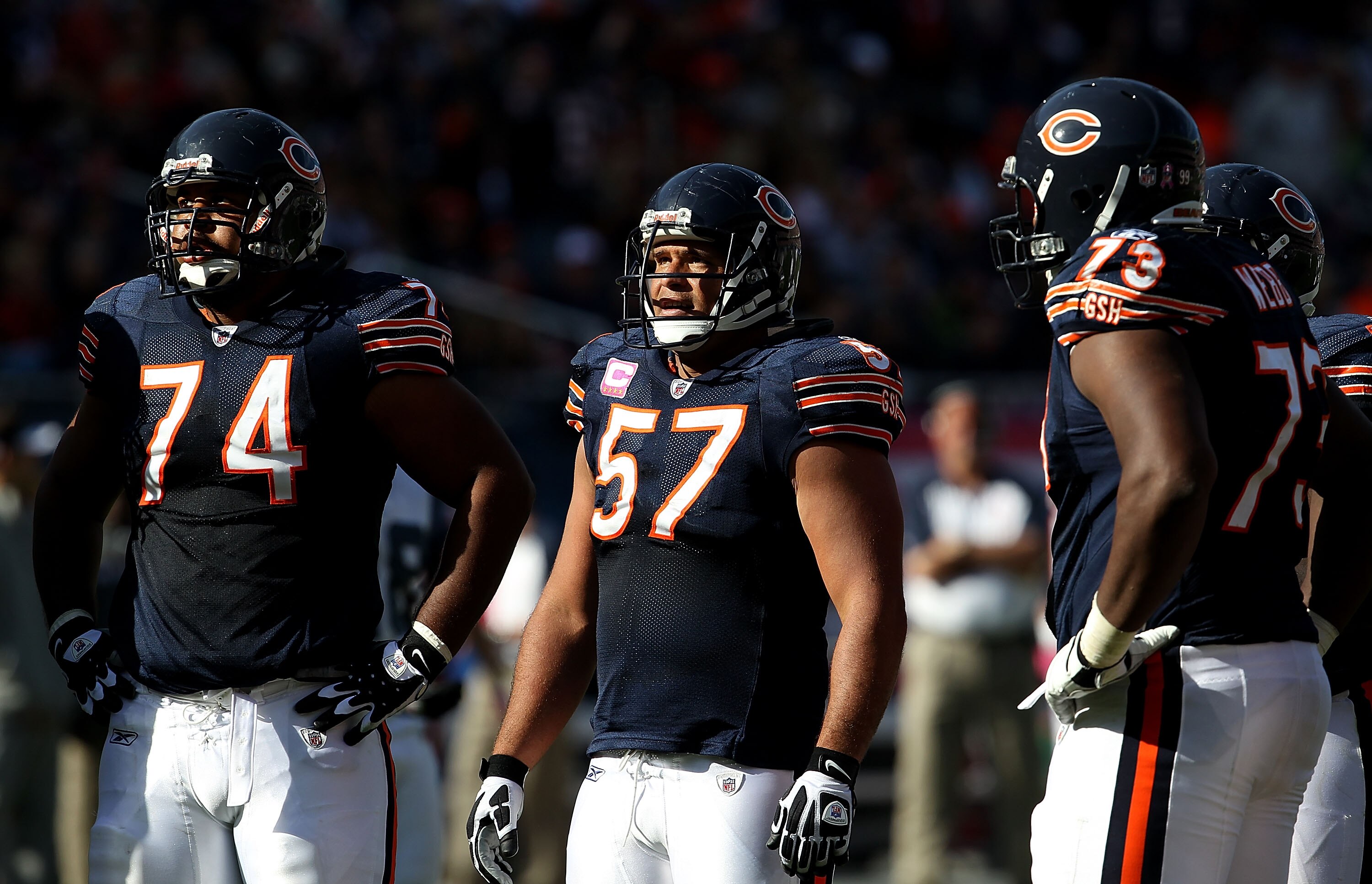 CHICAGO - OCTOBER 17: (L-R) Chris Williams #74, Olin Kreutz #57 and J'Marcus Webb #73 of the Chicago Bears wait in the huddle against the Seattle Seahawks at Soldier Field on October 17, 2010 in Chicago, Illinois. The Seahawks defeated the Bears 23-20. (P
