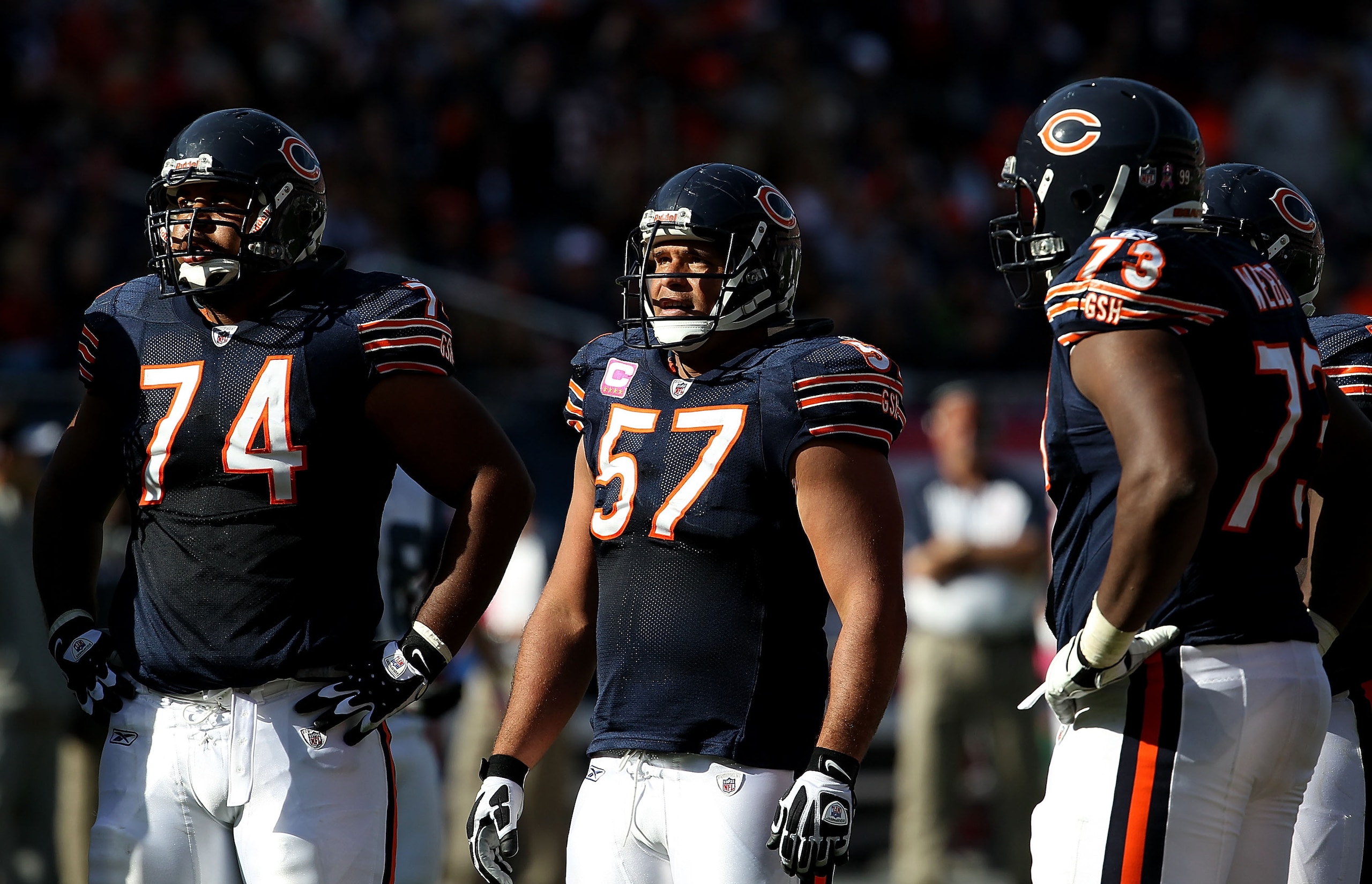 CHICAGO - OCTOBER 17: (L-R) Chris Williams #74, Olin Kreutz #57 and J'Marcus Webb #73 of the Chicago Bears wait in the huddle against the Seattle Seahawks at Soldier Field on October 17, 2010 in Chicago, Illinois. The Seahawks defeated the Bears 23-20. (P