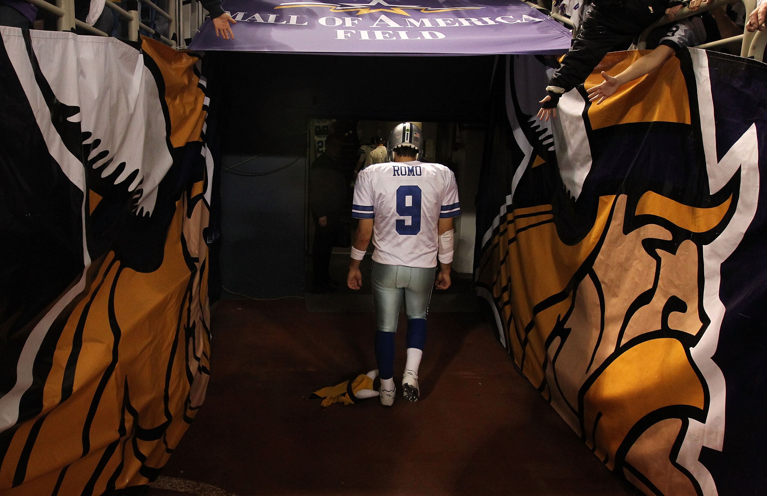 MINNEAPOLIS - JANUARY 17:  Quarterback Tony Romo #9 of the Dallas Cowboys walks off the field after being defeated 34-3 by the Minnesota Vikings during the NFC Divisional Playoff Game at Hubert H. Humphrey Metrodome on January 17, 2010 in Minneapolis, Min