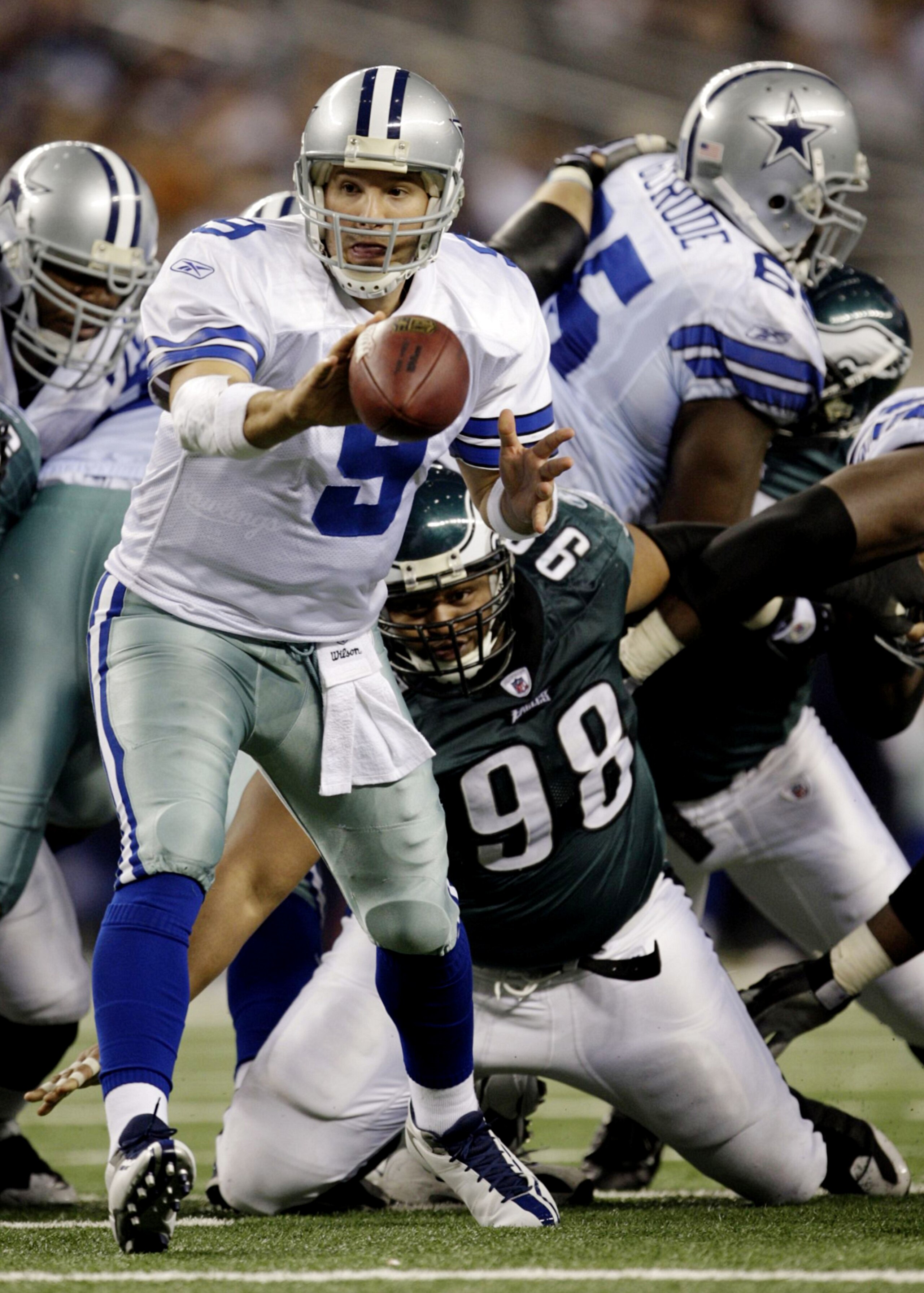 ARLINGTON, TX - JANUARY 9:  Tony Romo #9 of the Dallas Cowboys pitches the ball in the fourth quarter against the Philadelphia Eagles during the 2010 NFC wild-card playoff game at Cowboys Stadium on January 9, 2010 in Arlington, Texas. (Photo by Jamie Squ