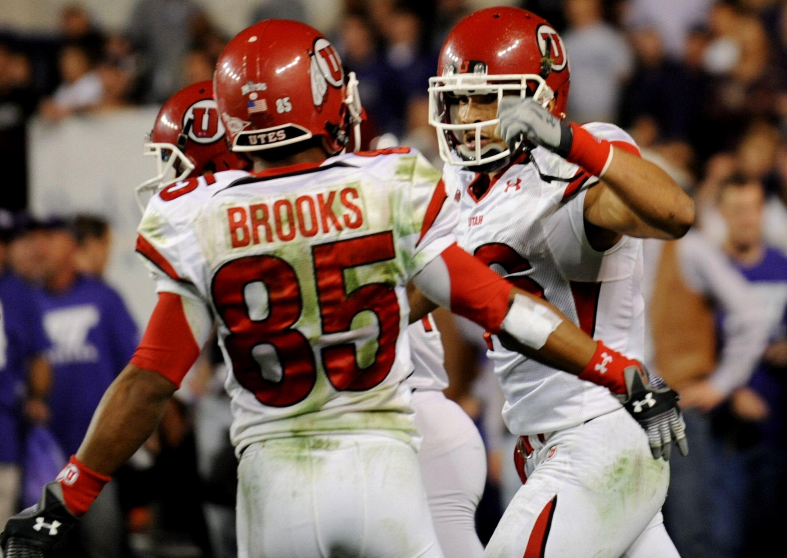 FORT WORTH, TX - NOVEMBER 14:  David Reed #16 of the Utah Utes celebrates with Jereme Brooks #85 after making a touchdown pass reception in the second quarter of the game against the TCU Horned Frogs at Amon G. Carter Stadium on November 14, 2009 in Fort 