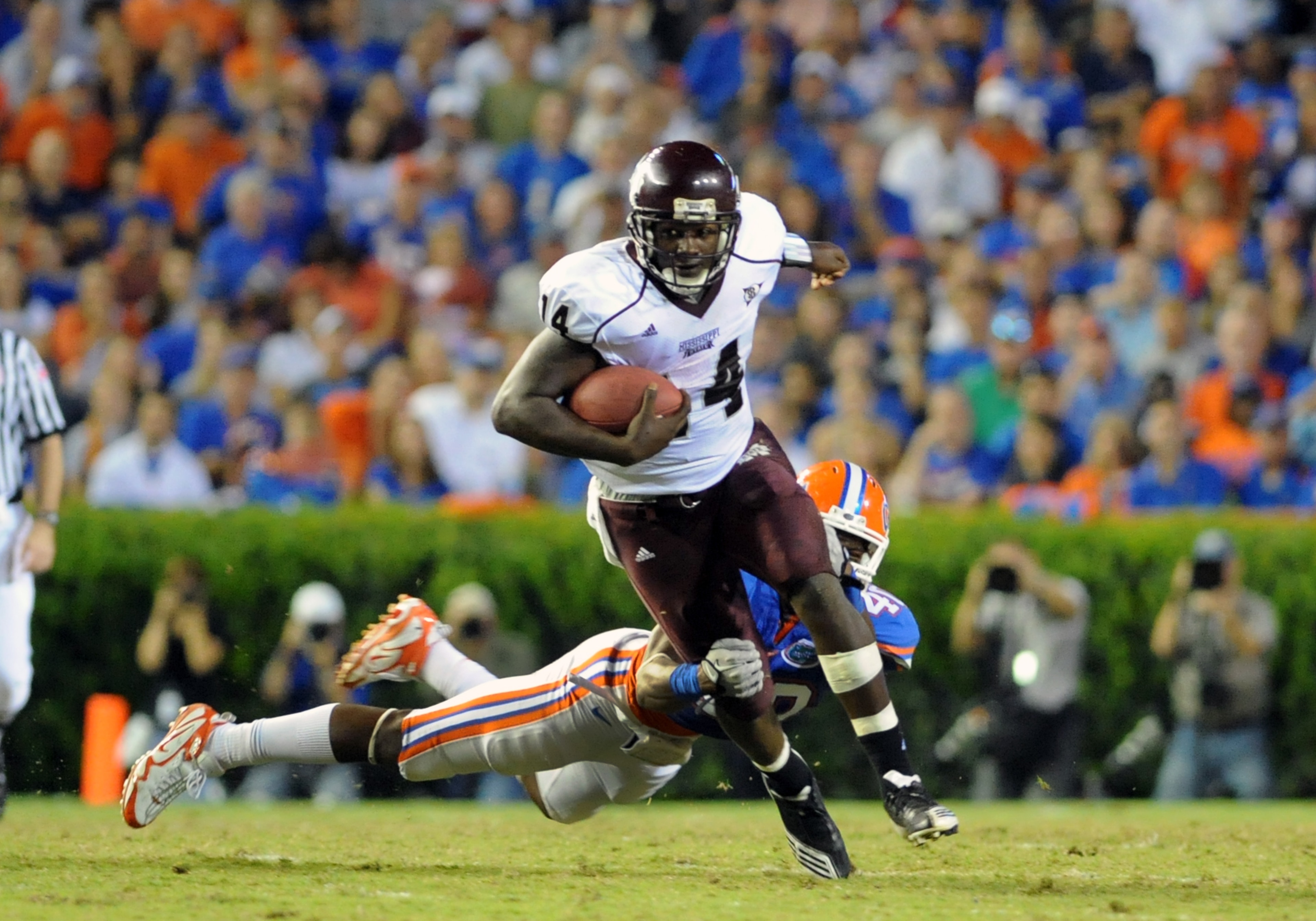 GAINESVILLE, FL - OCTOBER 16:  Quarterback Chris Relf #14 of the Mississippi State Bulldogs rushes upfield against the Florida Gators October 16, 2010 Ben Hill Griffin Stadium at Gainesville, Florida.  (Photo by Al Messerschmidt/Getty Images)