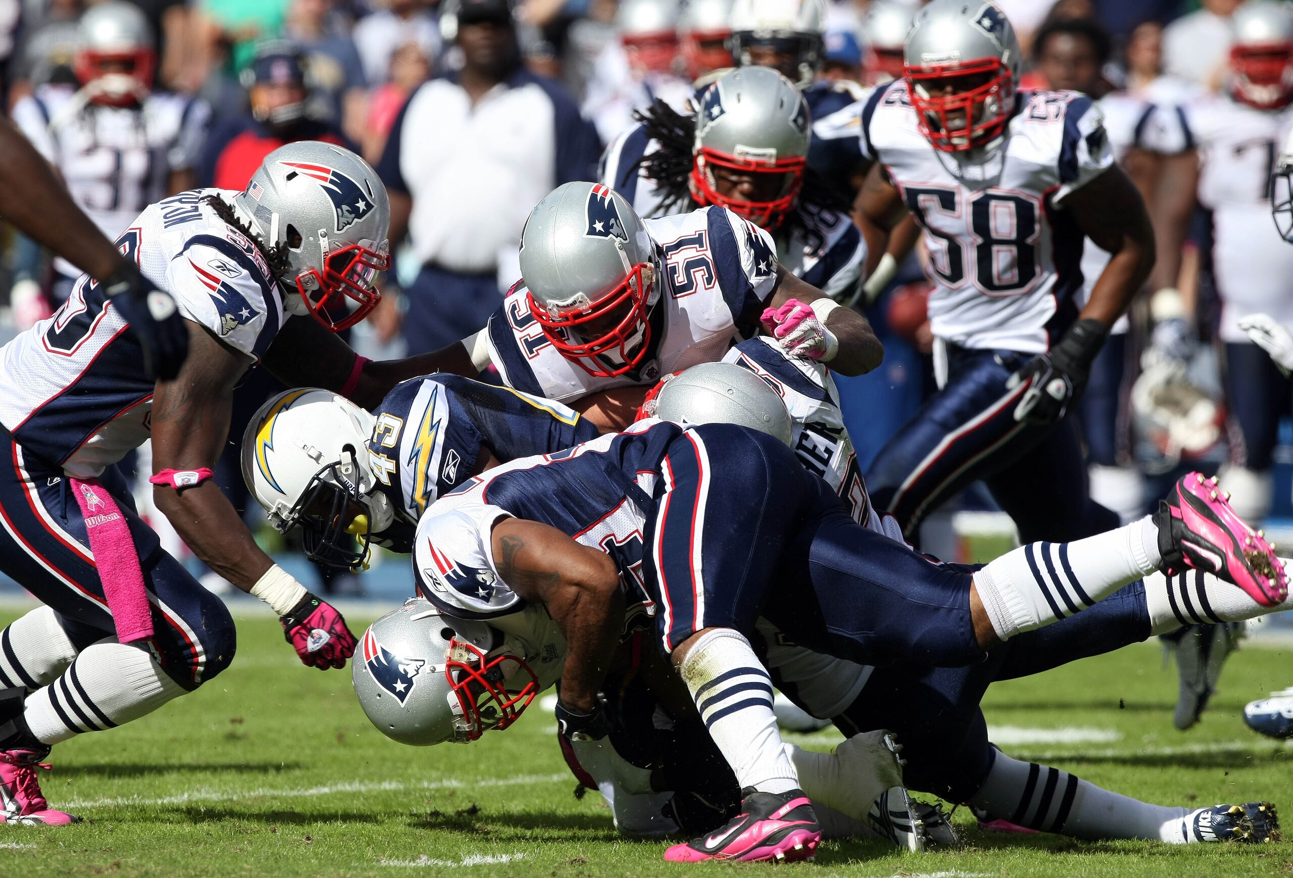 SAN DIEGO - OCTOBER 24:  Runningback Darren Sproles #43 of the San Diego Chargers is tackled by the New England Patriots Defense during NFL game on October 24, 2010 at Qualcomm Stadium in San Diego, California. (Photo by Donald Miralle/Getty Images)