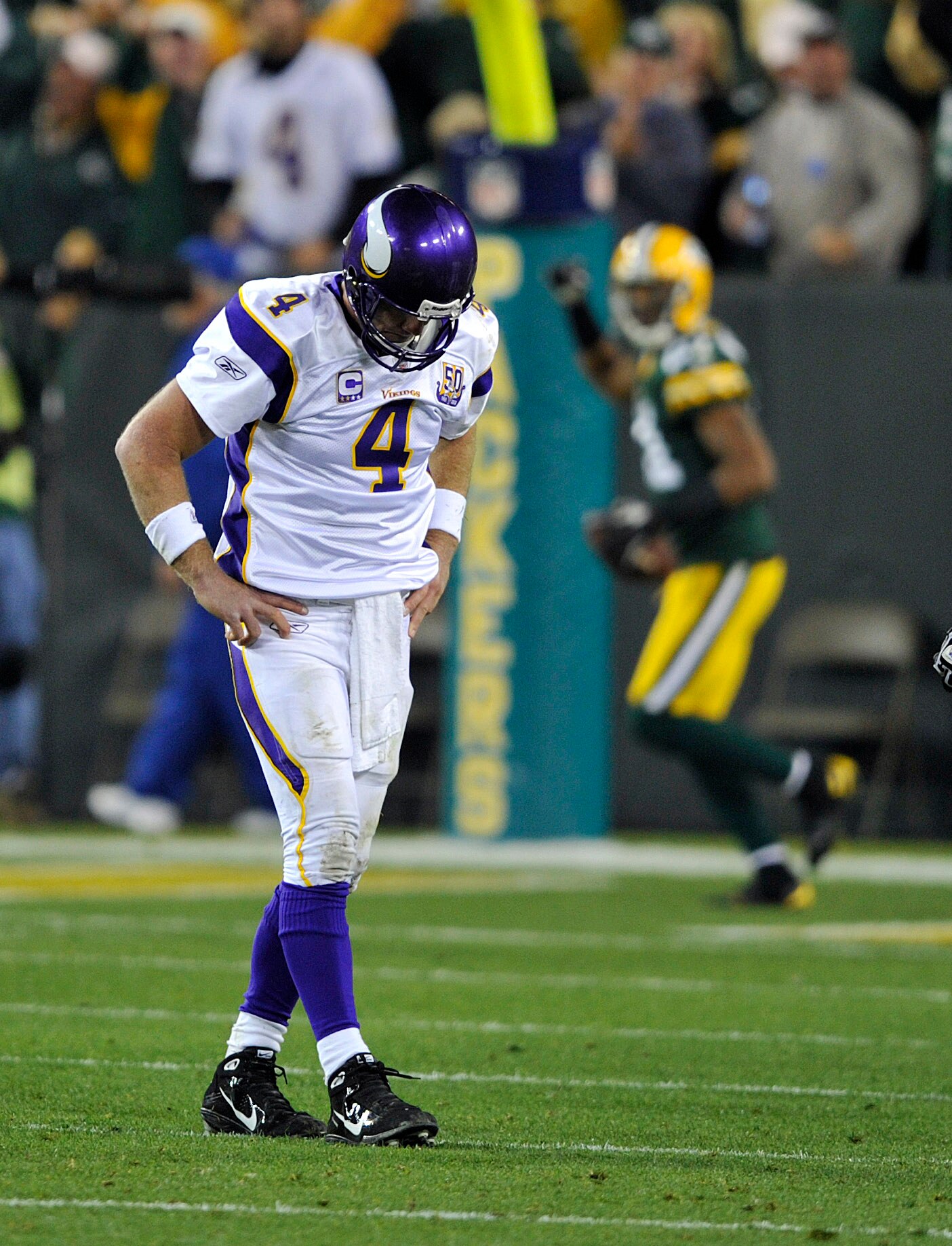 GREEN BAY, WI - OCTOBER 24:  Brett Favre #4 of the Minnesota Vikings reacts as Desmond Bishop #55 of the Green Bay Packers celebrates his interception for a touchdown at Lambeau Field on October 24, 2010 in Green Bay, Wisconsin. (Photo by Jim Prisching/Ge