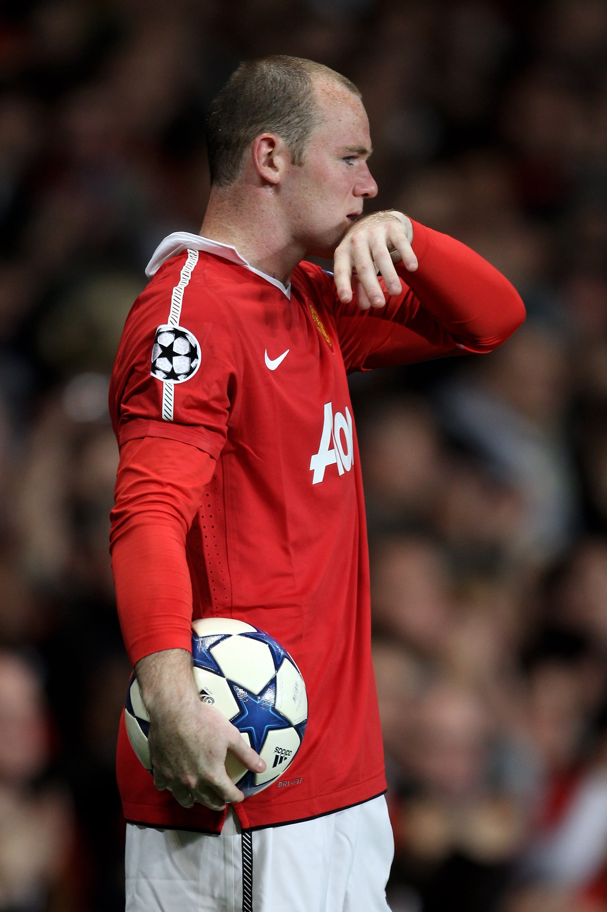 MANCHESTER, ENGLAND - SEPTEMBER 14:  Wayne Rooney of Manchester United reacts after team mate Antonio Valencia is injured during the UEFA Champions League Group C match between Manchester United and Rangers at Old Trafford on September 14, 2010 in Manches