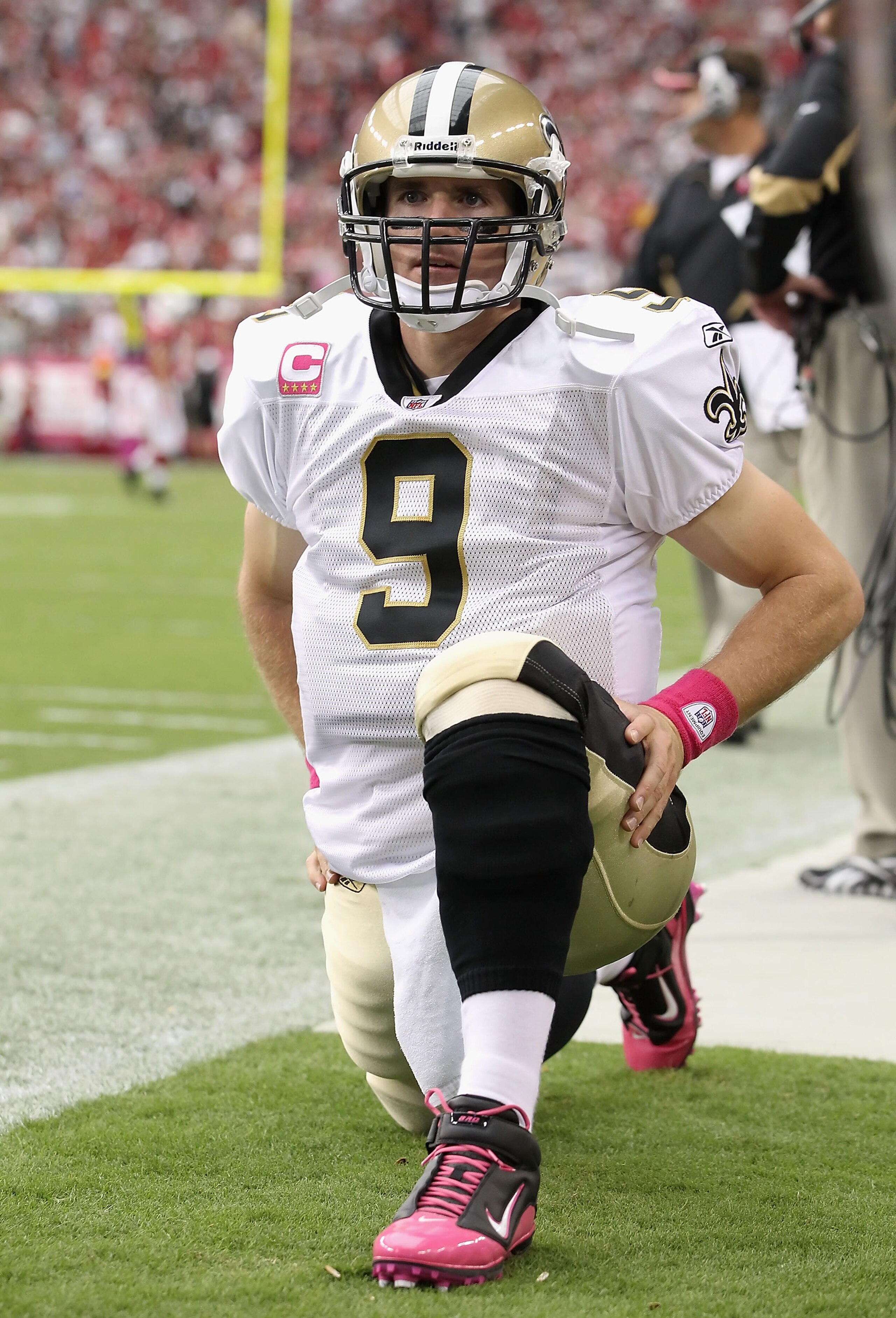 GLENDALE, AZ - OCTOBER 10:  Quarterback Drew Brees #9 of the New Orleans Saints warms up on the sidelines during the NFL game against the Arizona Cardinals at the University of Phoenix Stadium on October 10, 2010 in Glendale, Arizona. The Cardinals defeat