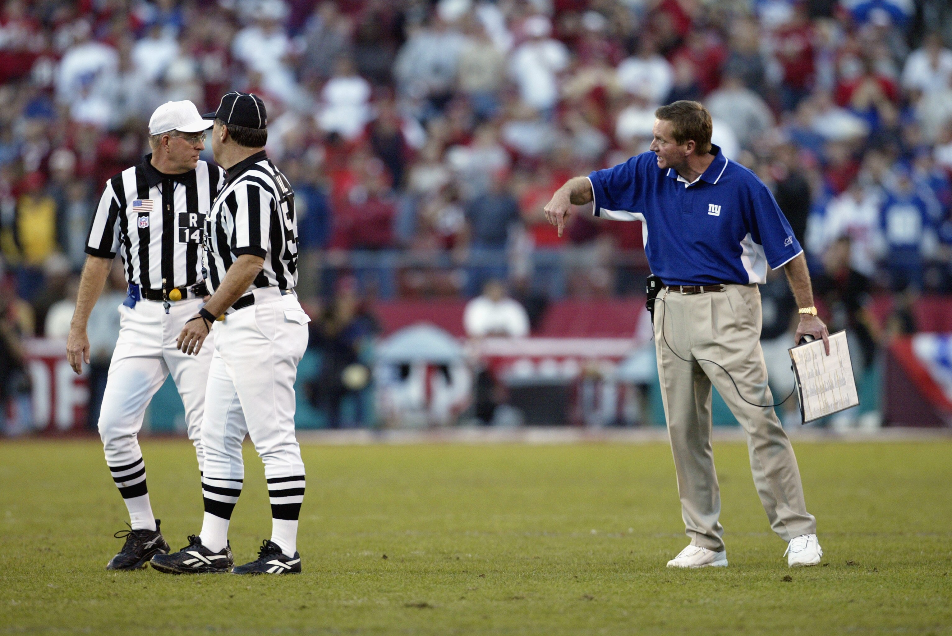 SAN FRANCISCO - JANUARY 5:  Head coach Jim Fassel of the New York Giants argues with the referees during the NFC Wild Card Game against the San Francisco 49ers at Candlestick Park on January 5, 2003 in San Francisco, California.  The 49ers won 39-38.  (Ph