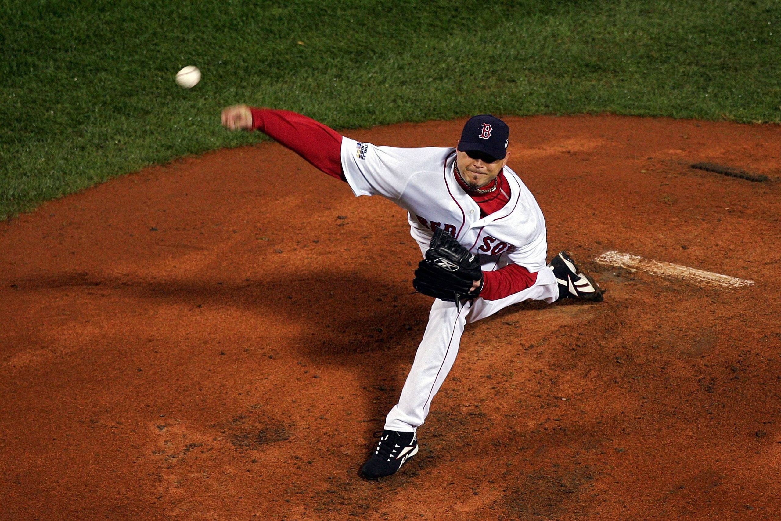BOSTON - OCTOBER 24:  Starting pitcher Josh Beckett #19 of the Boston Red Sox winds up against the Colorado Rockies during Game One of the 2007 Major League Baseball World Series at Fenway Park on October 24, 2007 in Boston, Massachusetts.  (Photo by Jim