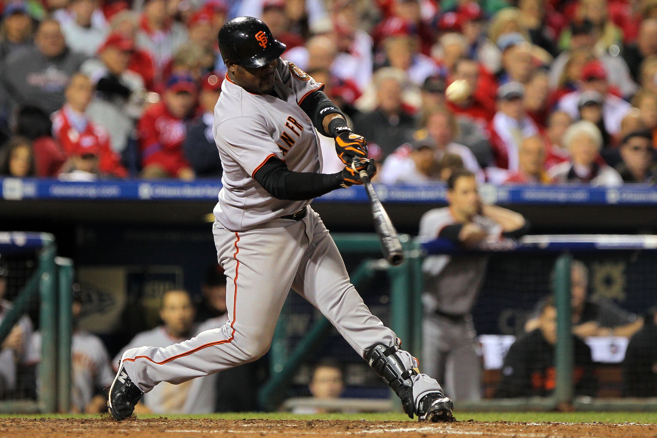 PHILADELPHIA - OCTOBER 23:  Juan Uribe #5 of the San Francisco Giants hits a solo home run to take a 3-2 lead in the eigth inning against the Philadelphia Phillies in Game Six of the NLCS during the 2010 MLB Playoffs at Citizens Bank Park on October 23, 2