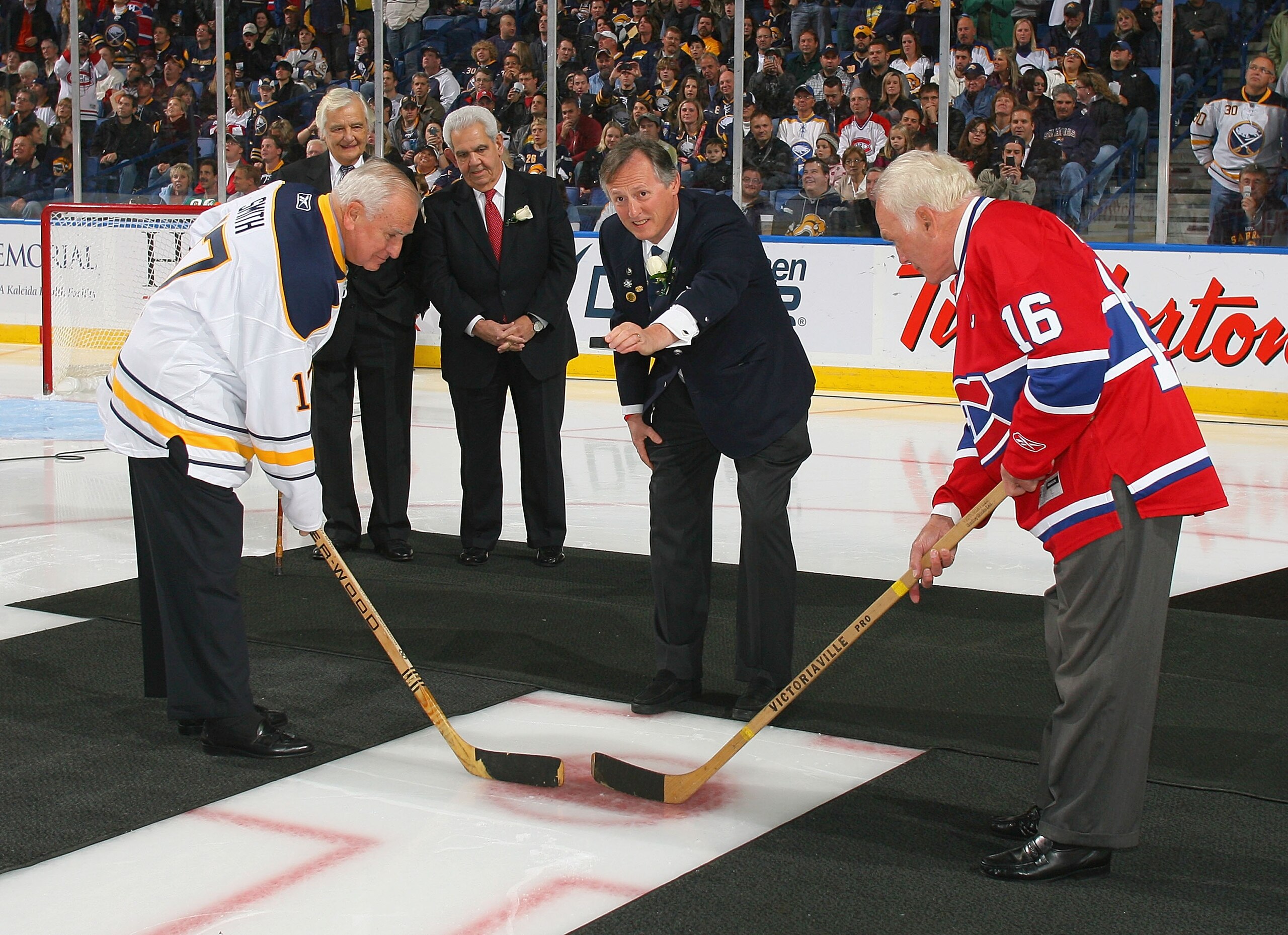 BUFFALO, NY - OCTOBER 15: Former Buffalo Sabres owner Seymour Knox III re-enacts the first puck drop at the first home game for the Buffalo Sabres 40 years ago on this date against  the Montreal Canadiens  against at HSBC Arena on October 15, 2010 in Buff