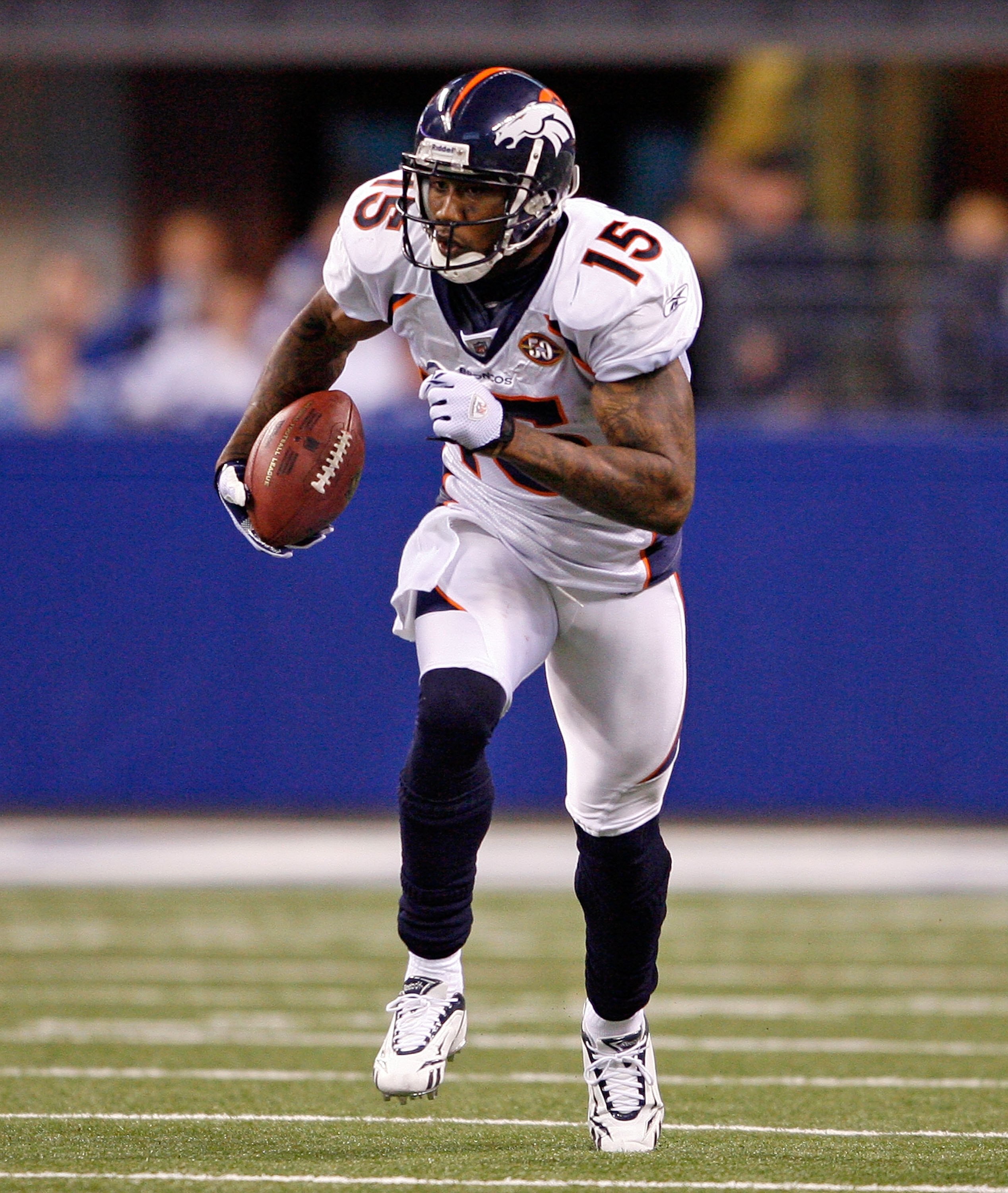 INDIANAPOLIS - DECEMBER 13:  Brandon Marshall #15 of the Denver Broncos runs with the ball during the NFL game against the Indianapolis Colts at Lucas Oil Stadium on December 13, 2009 in Indianapolis, Indiana.  The Colts won 28-16.  (Photo by Andy Lyons/G